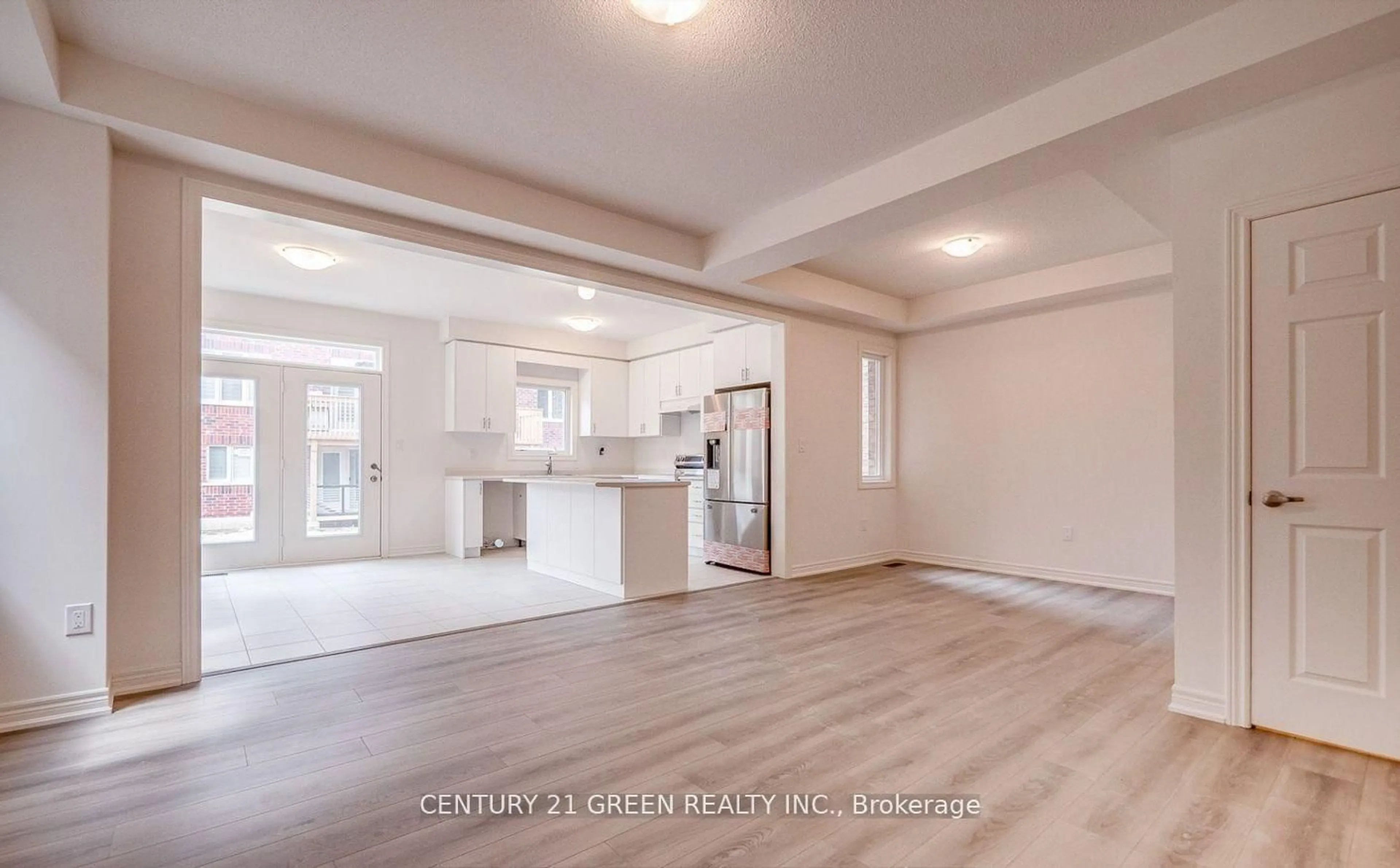 Open concept kitchen, wood/laminate floor for 59 Hager Crk Terr, Hamilton Ontario L8B 1Z3