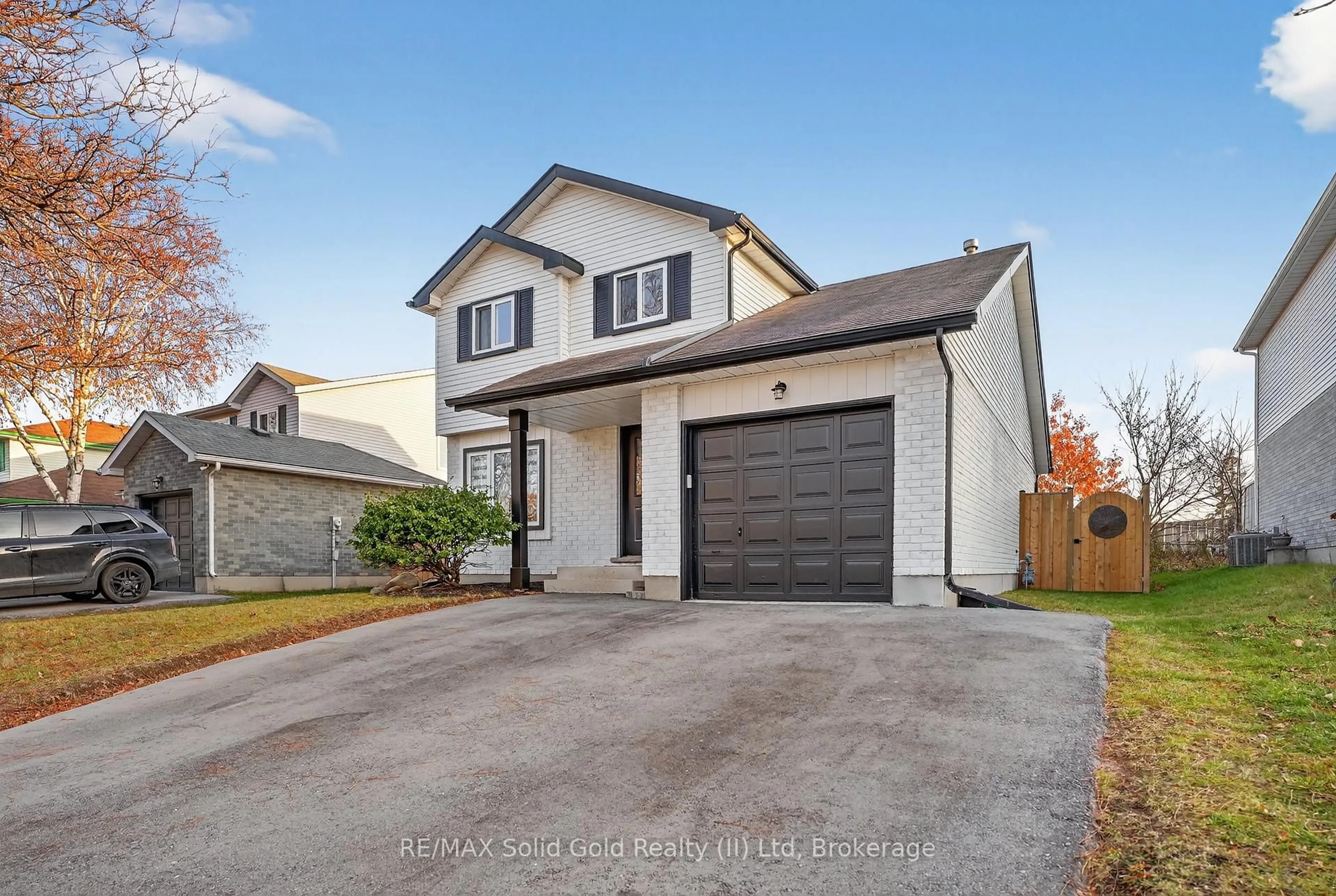 Home with vinyl exterior material, street for 23 Rushbrook Dr, Kitchener Ontario N2E 3C1