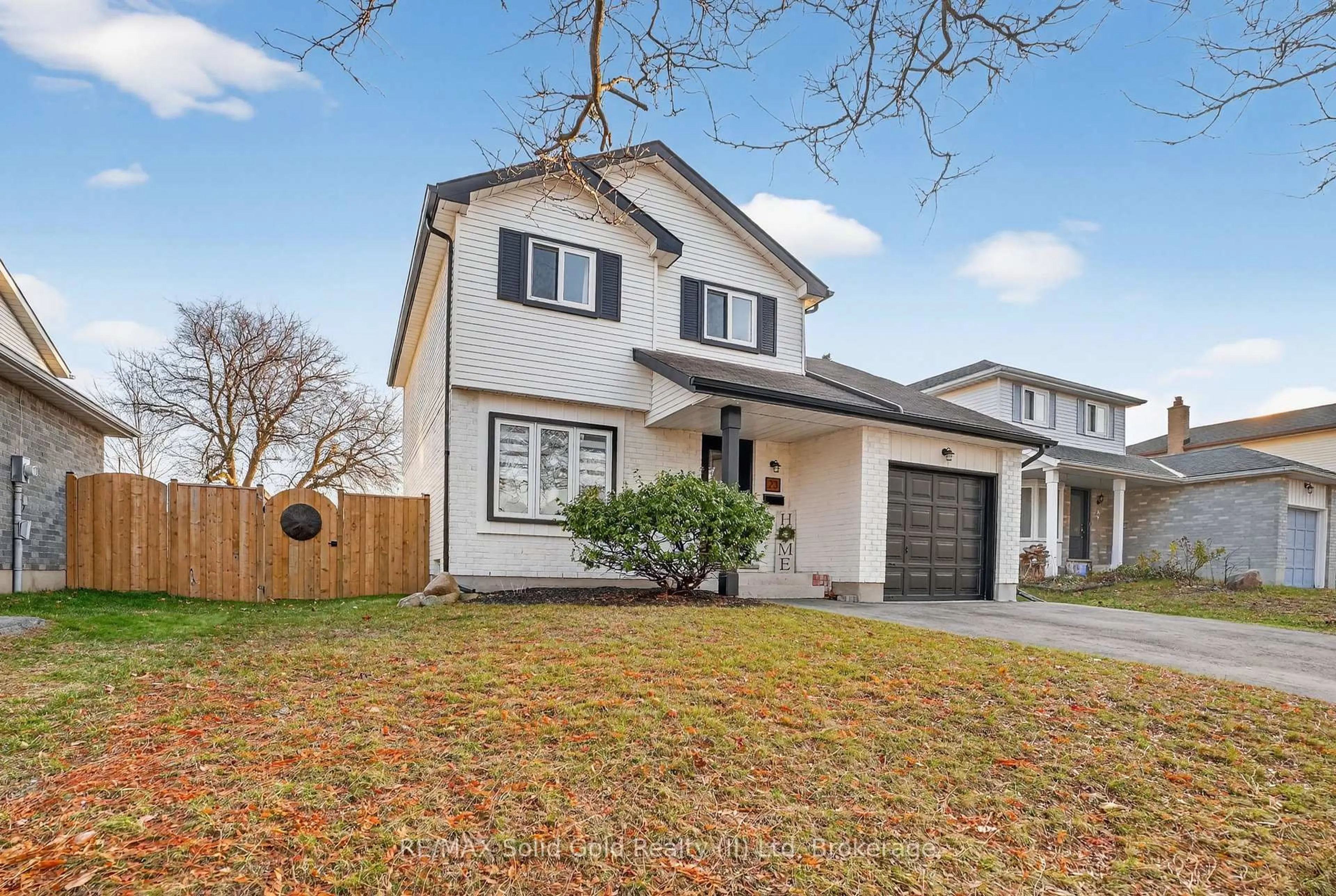 Home with vinyl exterior material, street for 23 Rushbrook Dr, Kitchener Ontario N2E 3C1