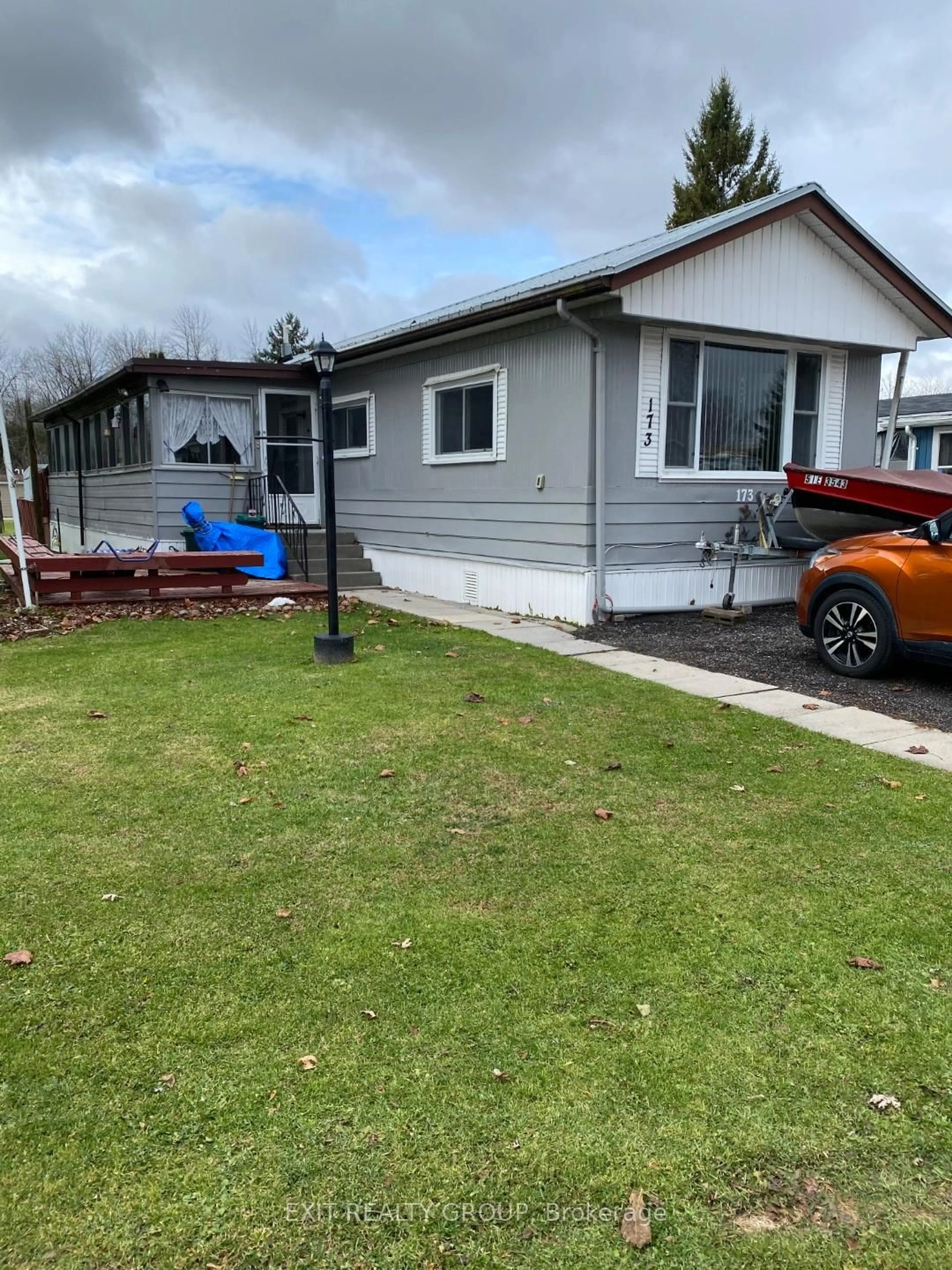 A pic from outside/outdoor area/front of a property/back of a property/a pic from drone, street for 63 Whites Rd #173, Quinte West Ontario K9V 5P5