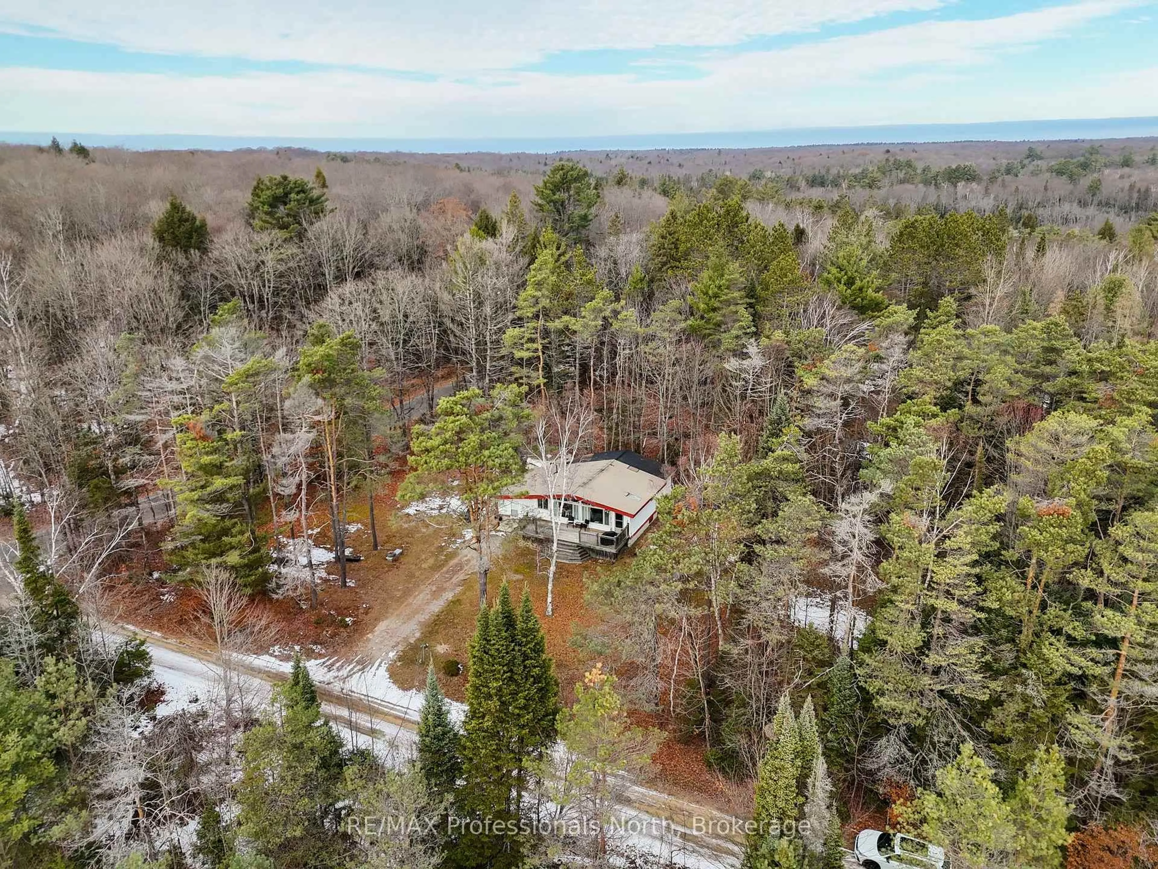 A pic from outside/outdoor area/front of a property/back of a property/a pic from drone, forest/trees view for 1001 Colony Tr, Bracebridge Ontario P1L 1X3