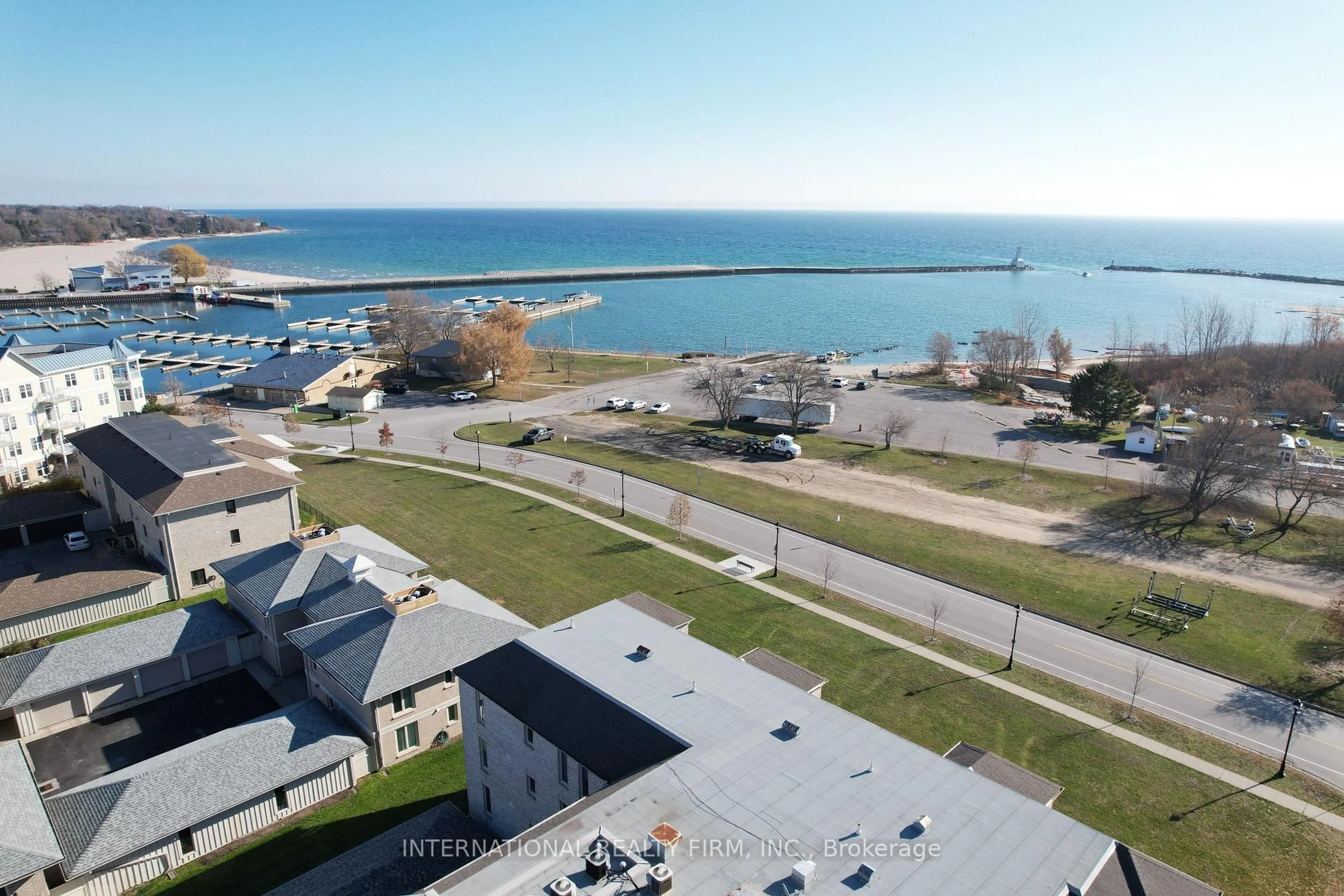 A pic from outside/outdoor area/front of a property/back of a property/a pic from drone, water/lake/river/ocean view for 138 Hibernia St #203, Cobourg Ontario K9A 3J8