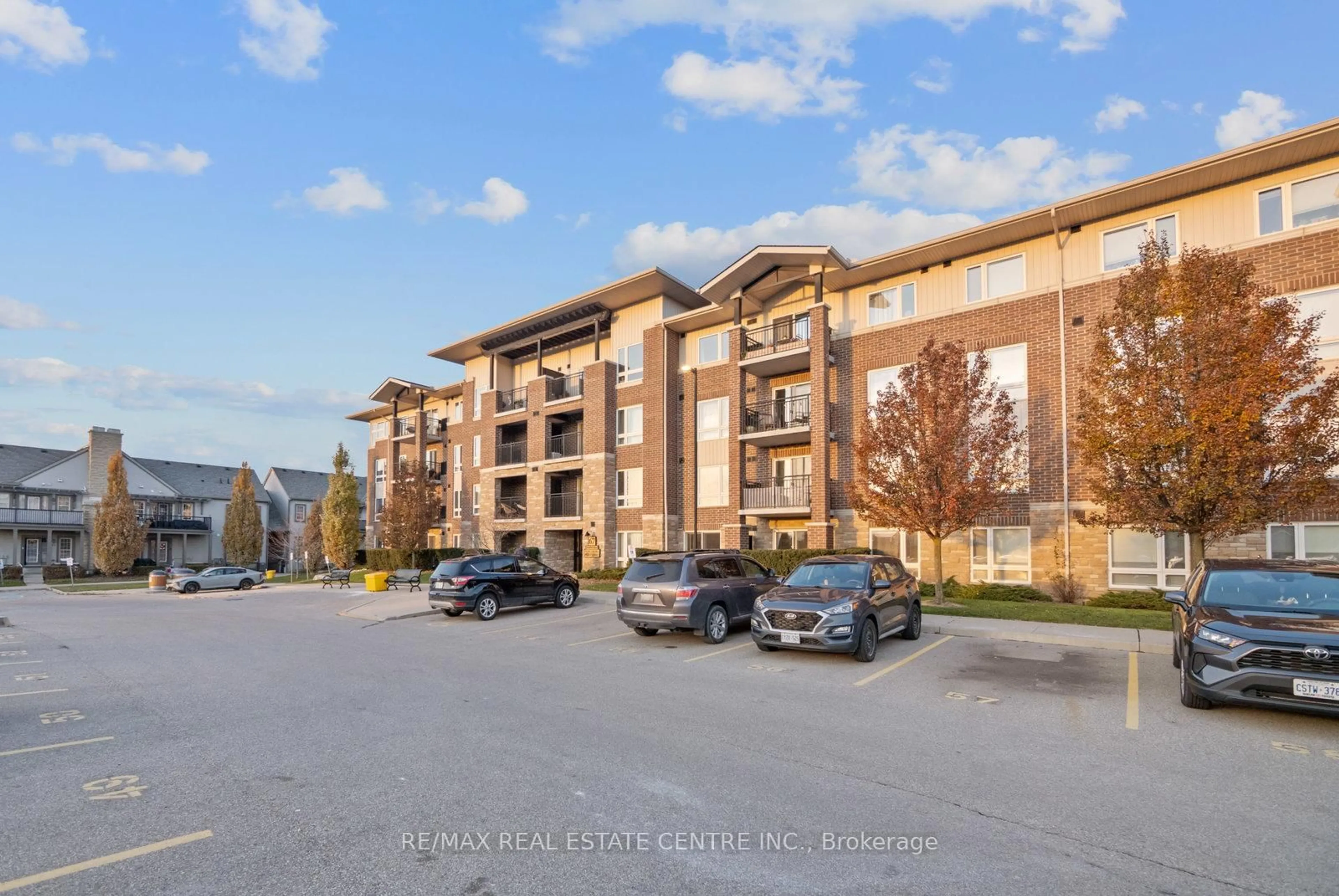 A pic from outside/outdoor area/front of a property/back of a property/a pic from drone, unknown for 67 Kingsbury Sq #304, Guelph Ontario N1L 0L3