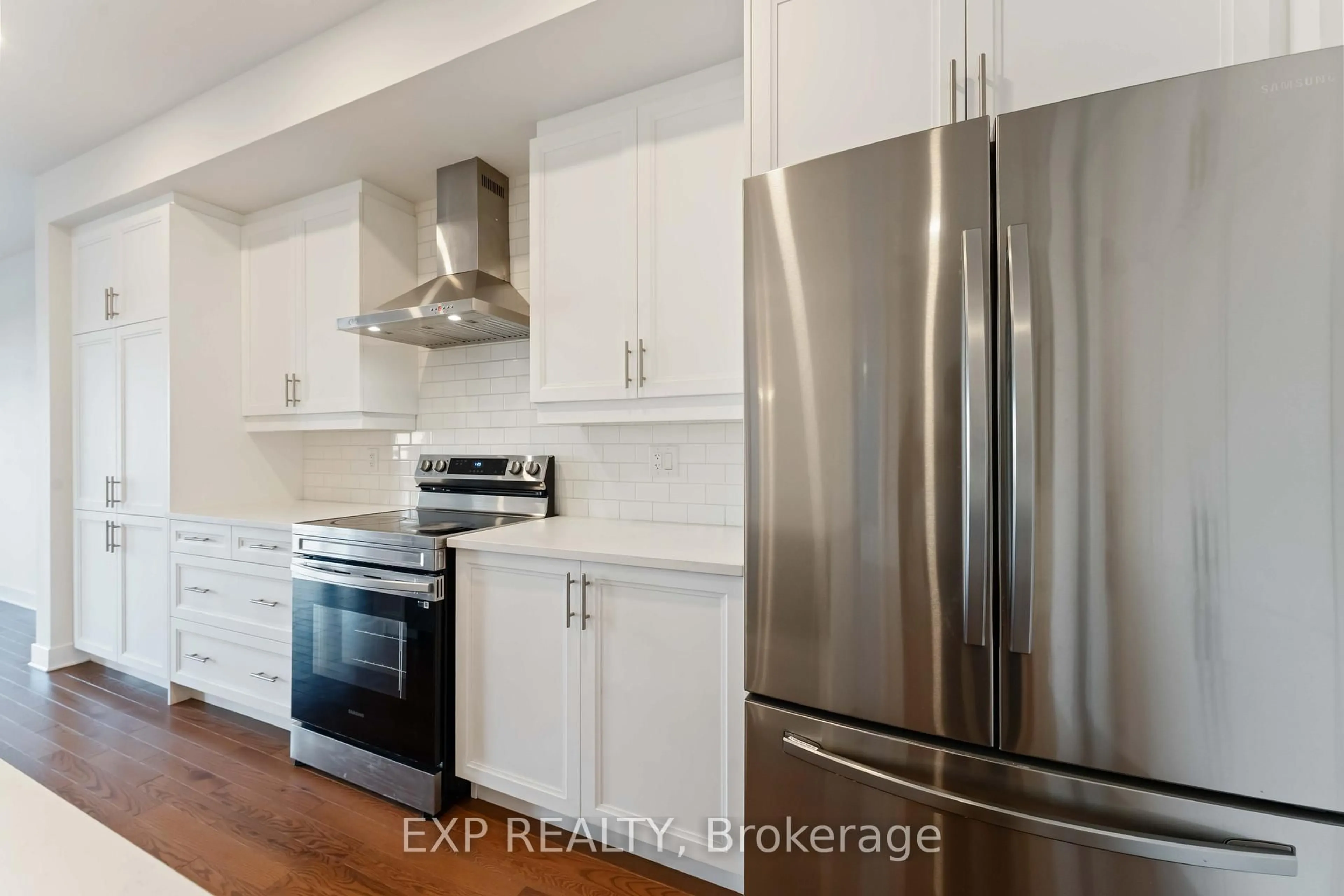 Open concept kitchen, wood/laminate floor for 796 Solarium Ave, Ottawa Ontario K4M 0N7