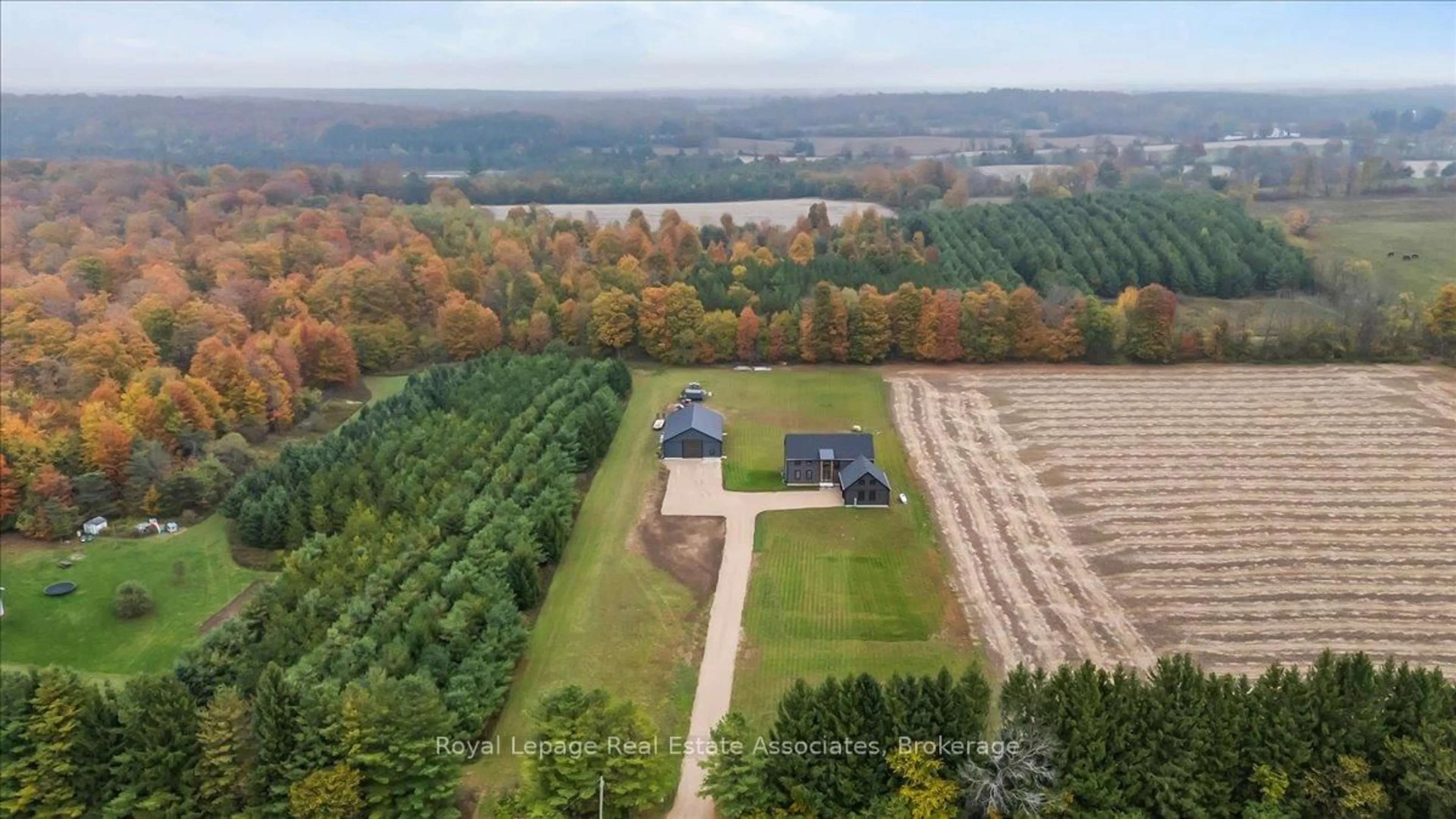 A pic from outside/outdoor area/front of a property/back of a property/a pic from drone, forest/trees view for 174265 Mulock Rd, West Grey Ontario N4N 3B9