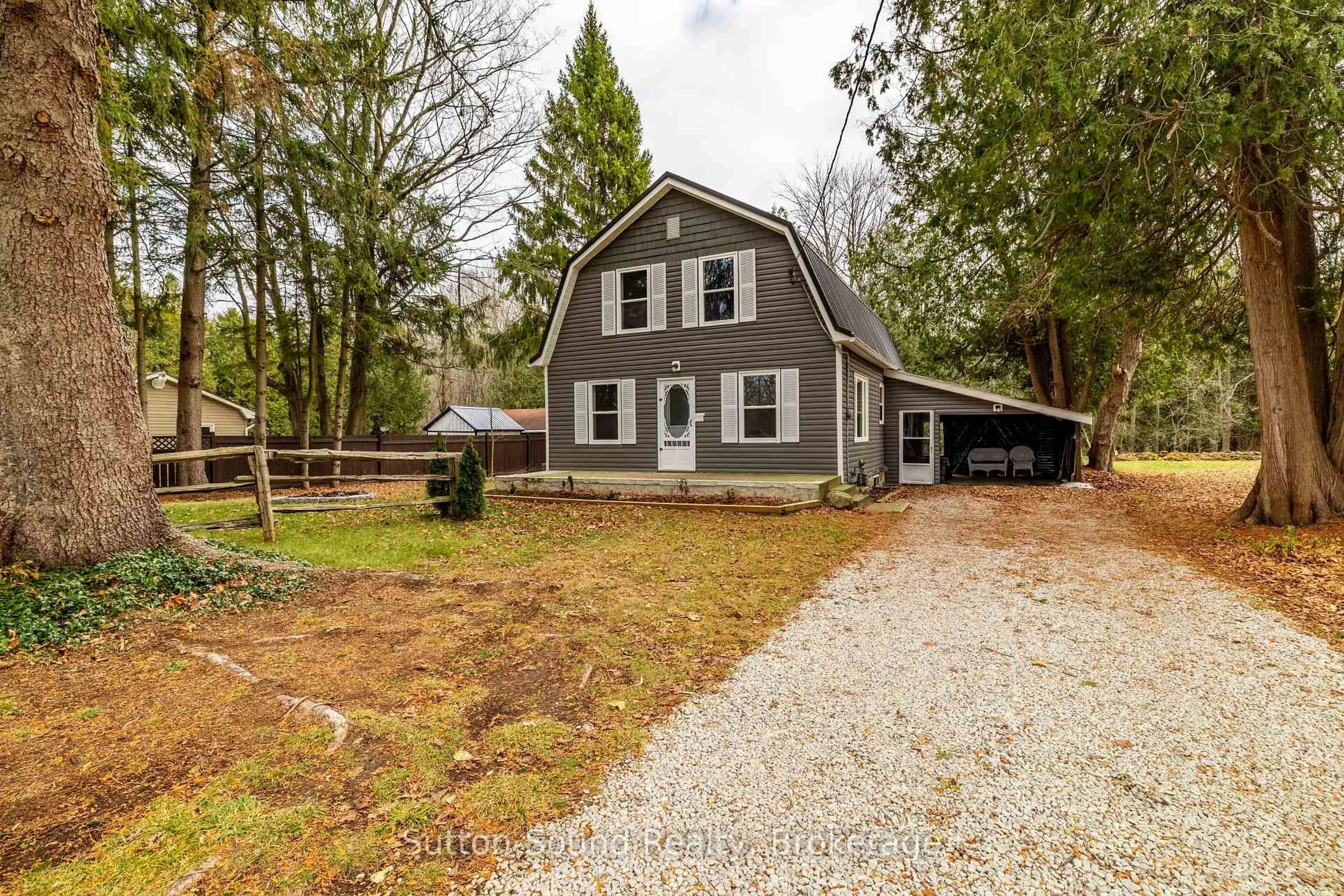 A pic from outside/outdoor area/front of a property/back of a property/a pic from drone, street for 318777 Grey Road 1 Rd, Georgian Bluffs Ontario N4K 5N4