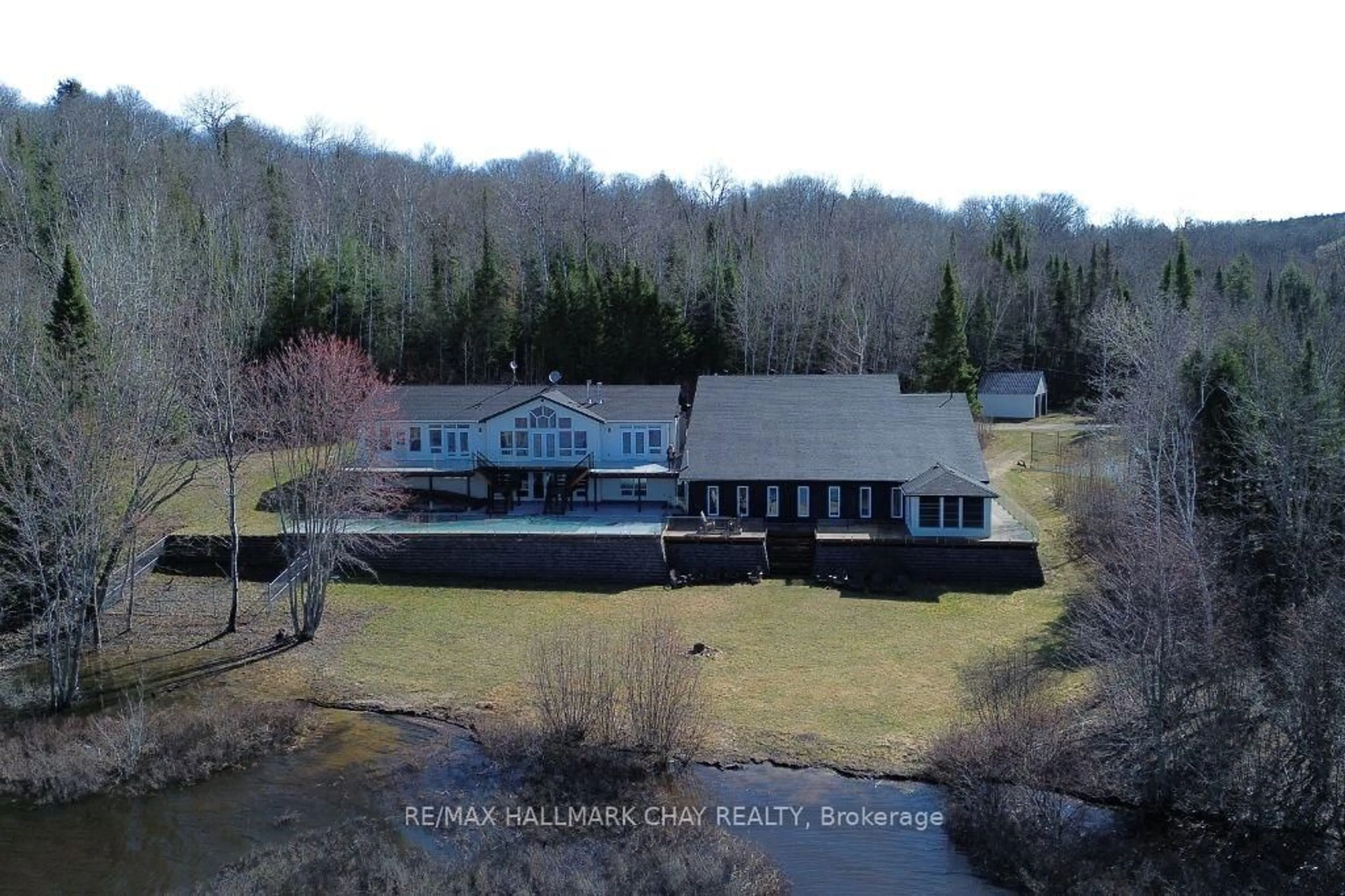A pic from outside/outdoor area/front of a property/back of a property/a pic from drone, water/lake/river/ocean view for 2318 Pickerel & Jack Lake Rd, Armour Ontario P0A 1C0