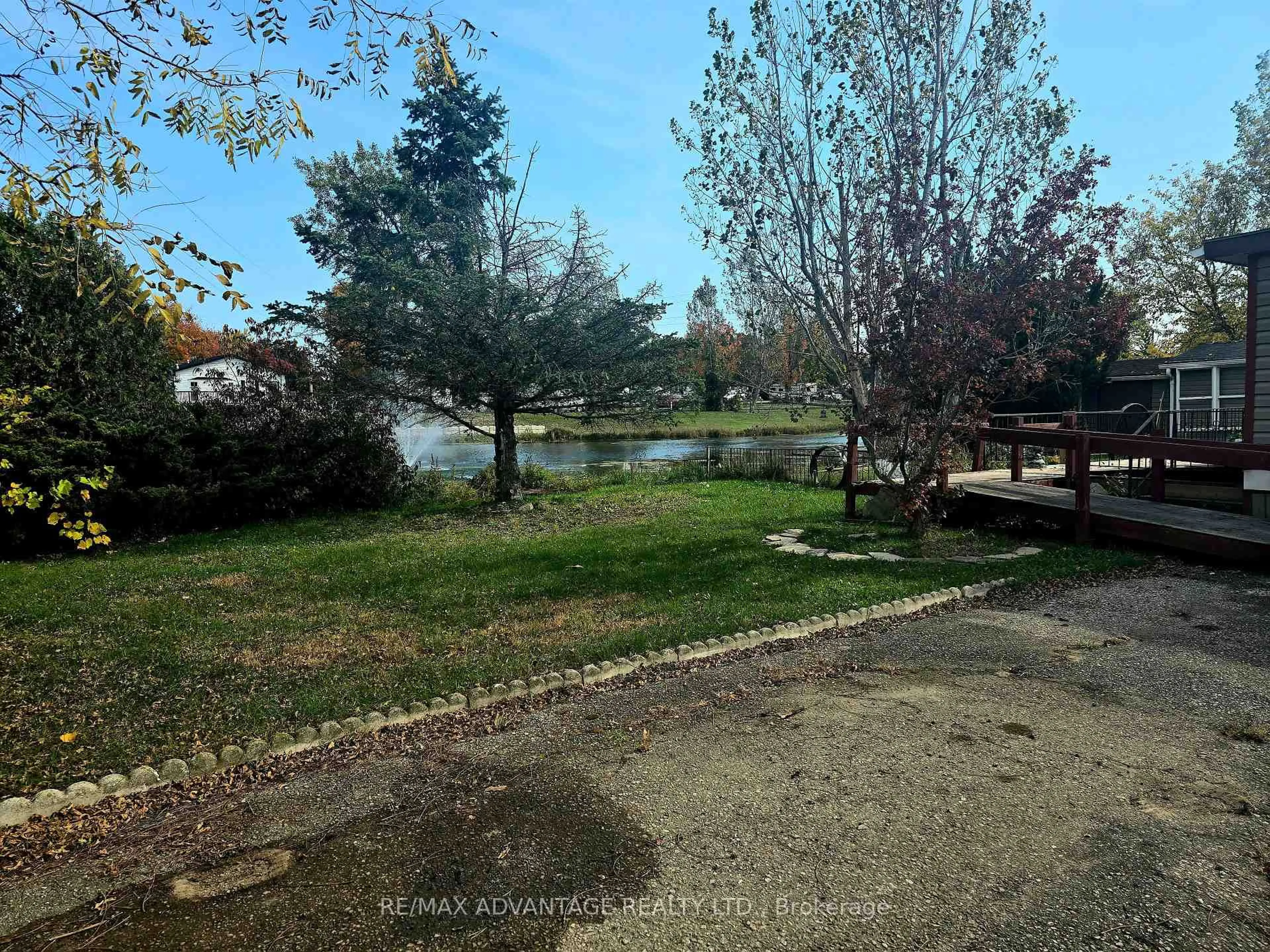 A pic from outside/outdoor area/front of a property/back of a property/a pic from drone, water/lake/river/ocean view for 4340 Cromarty Dr #B11, Thames Centre Ontario N0L 1V0