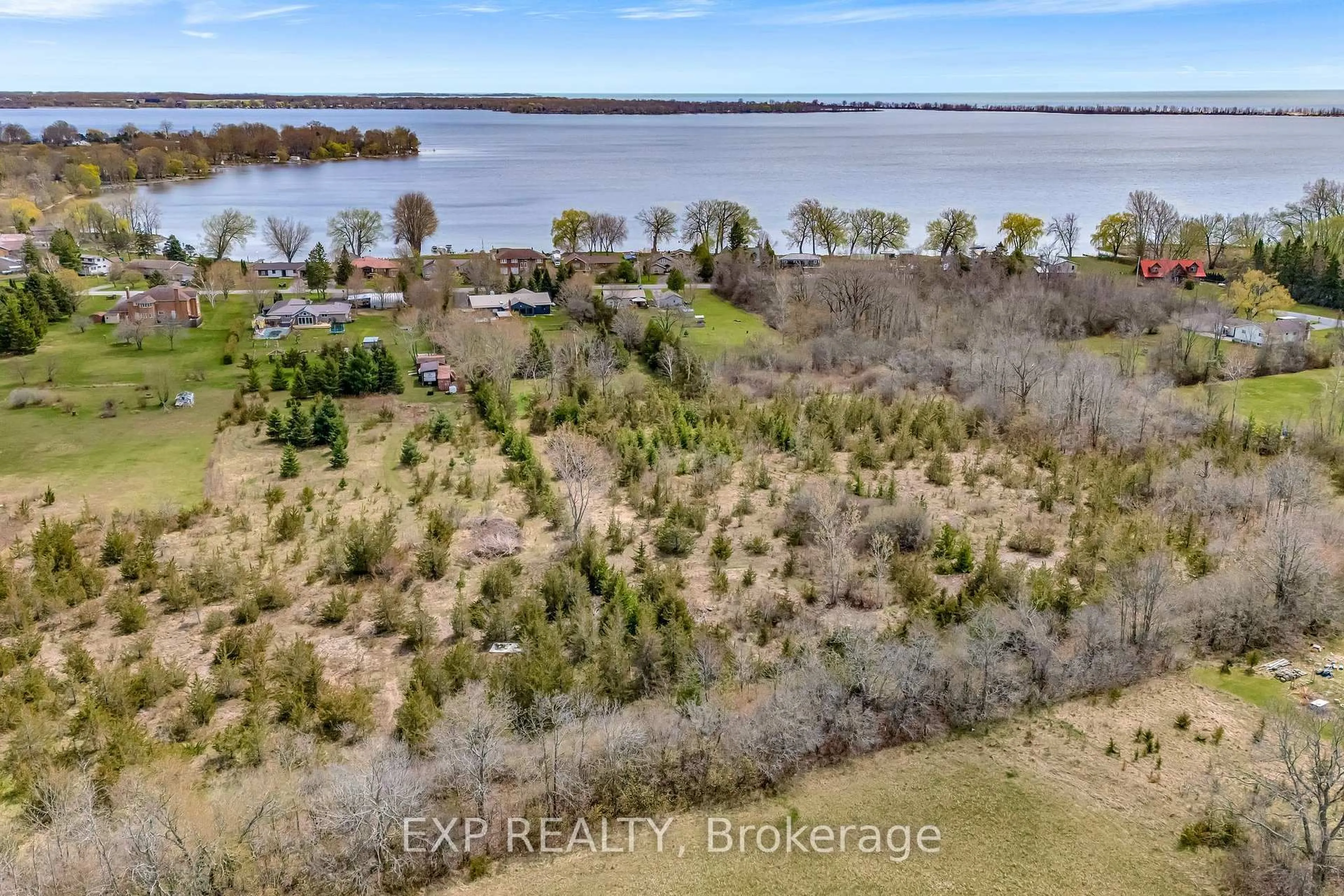 A pic from outside/outdoor area/front of a property/back of a property/a pic from drone, water/lake/river/ocean view for 135 Hiscock Shores Rd, Prince Edward County Ontario K0K 1L0