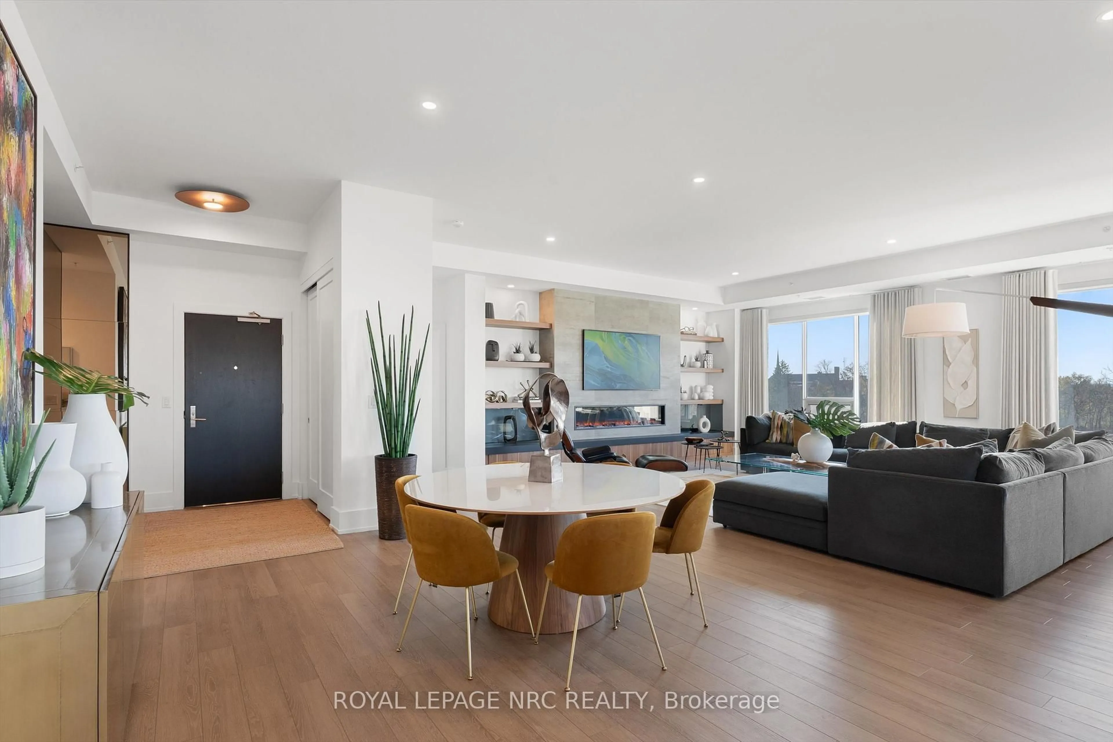 Living room with furniture, wood/laminate floor for 77 Yates St #601, St. Catharines Ontario L2R 0C4