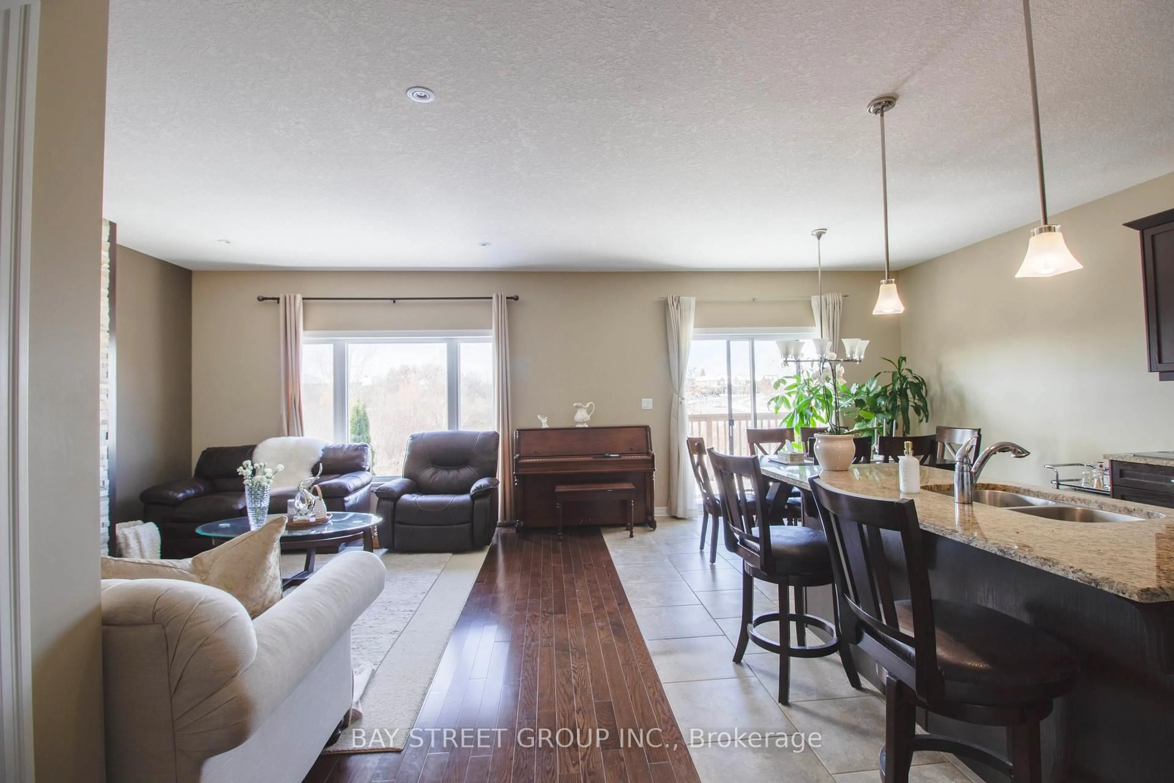 Living room with furniture, wood/laminate floor for 1451 Howlett Circ, London North Ontario N5X 0K5