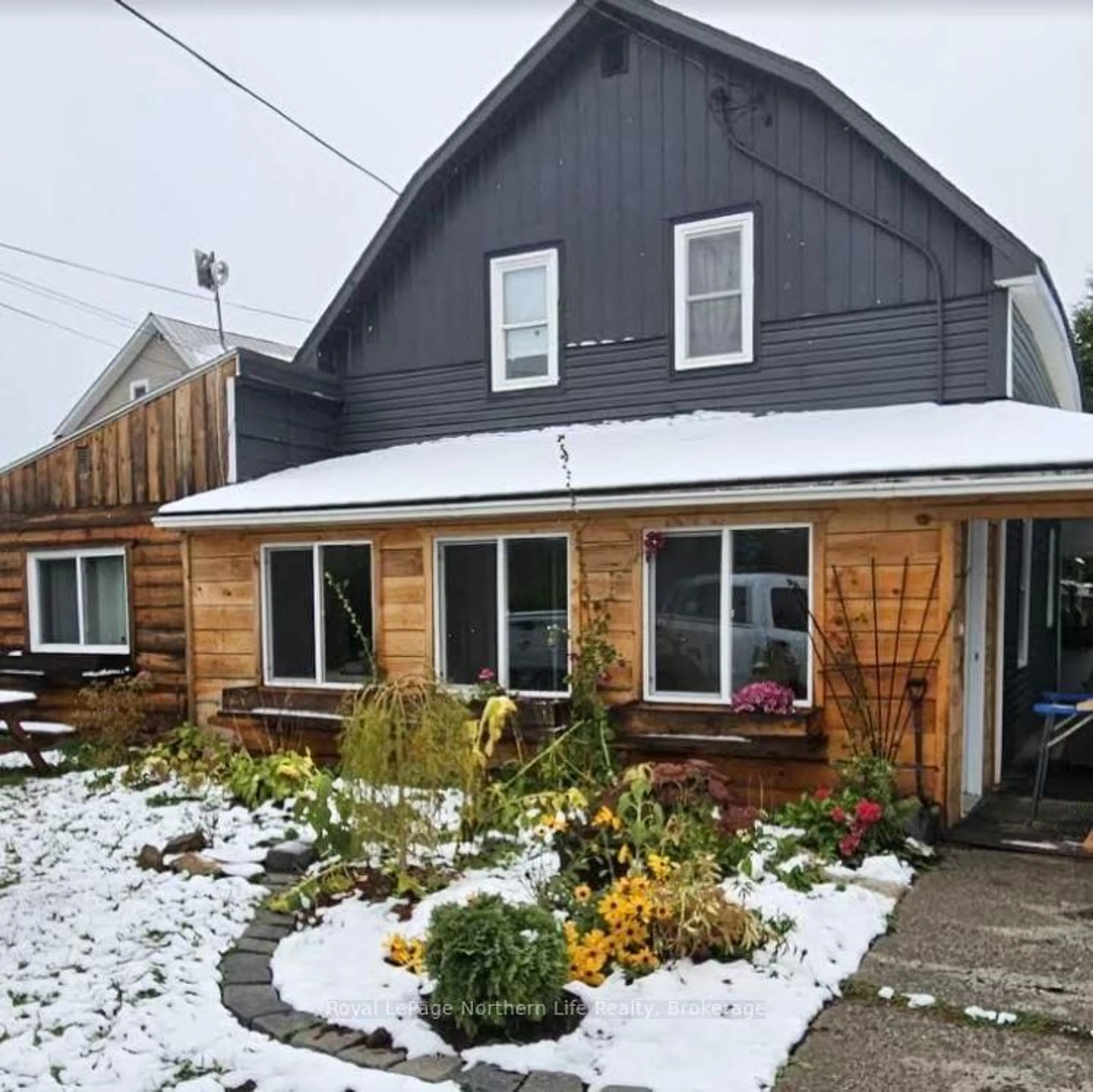 Home with vinyl exterior material, street for 6741 Highway 11, Temagami Ontario P0H 2H0