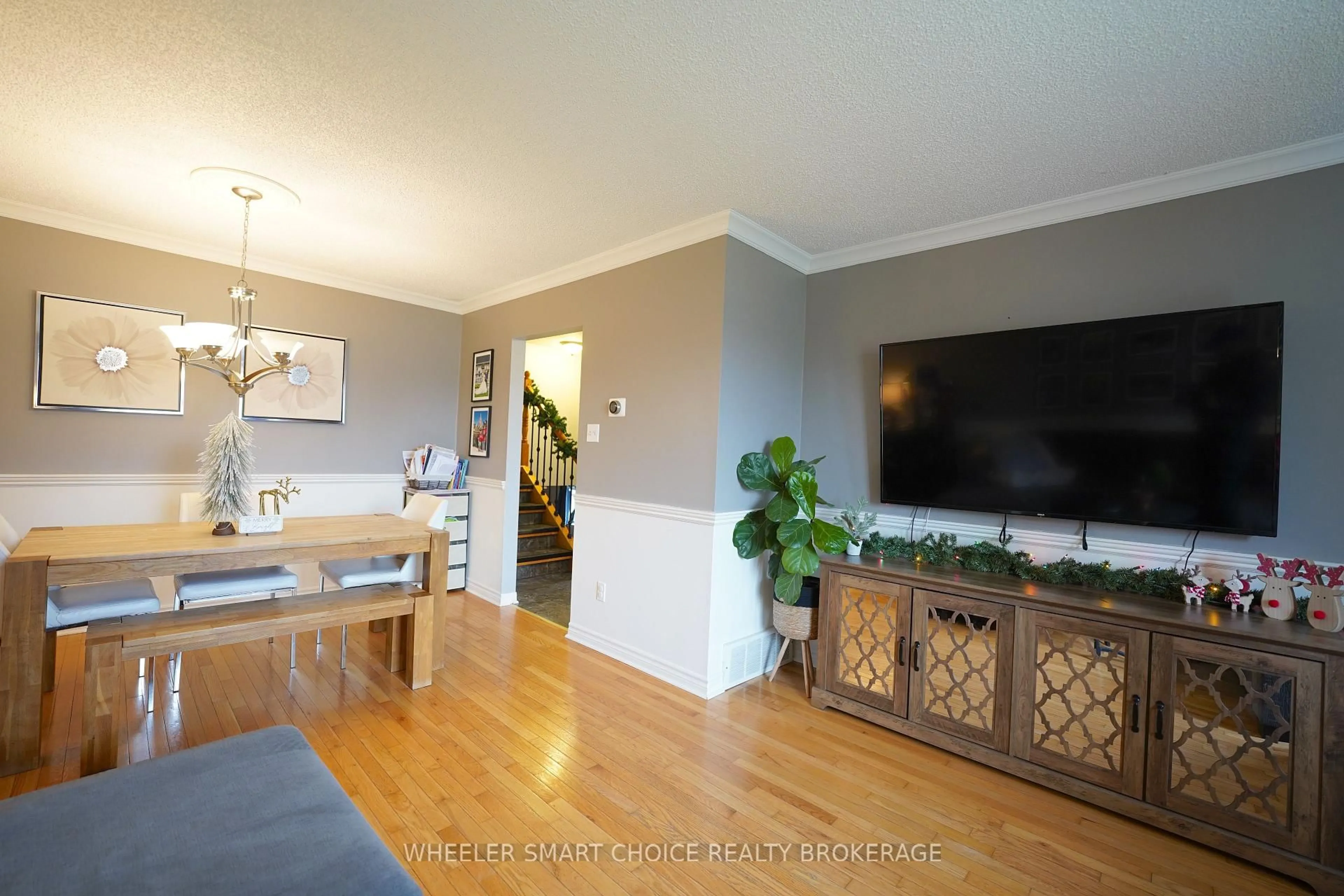 Living room with furniture, wood/laminate floor for 402 Cline Ave, Cornwall Ontario K6J 5M8