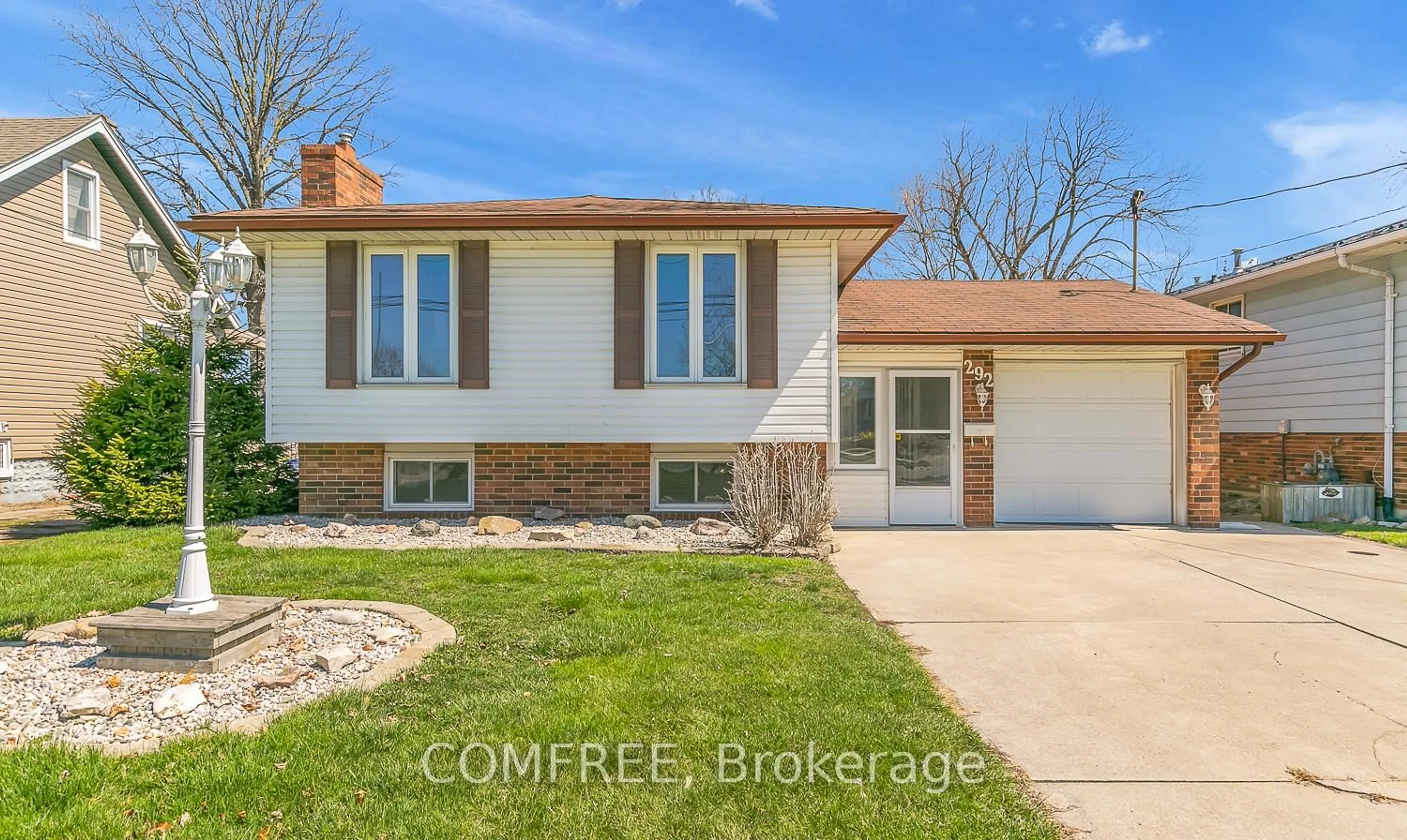 Home with vinyl exterior material, street for 292 Lesperance Rd, Tecumseh Ontario N8N 1W3