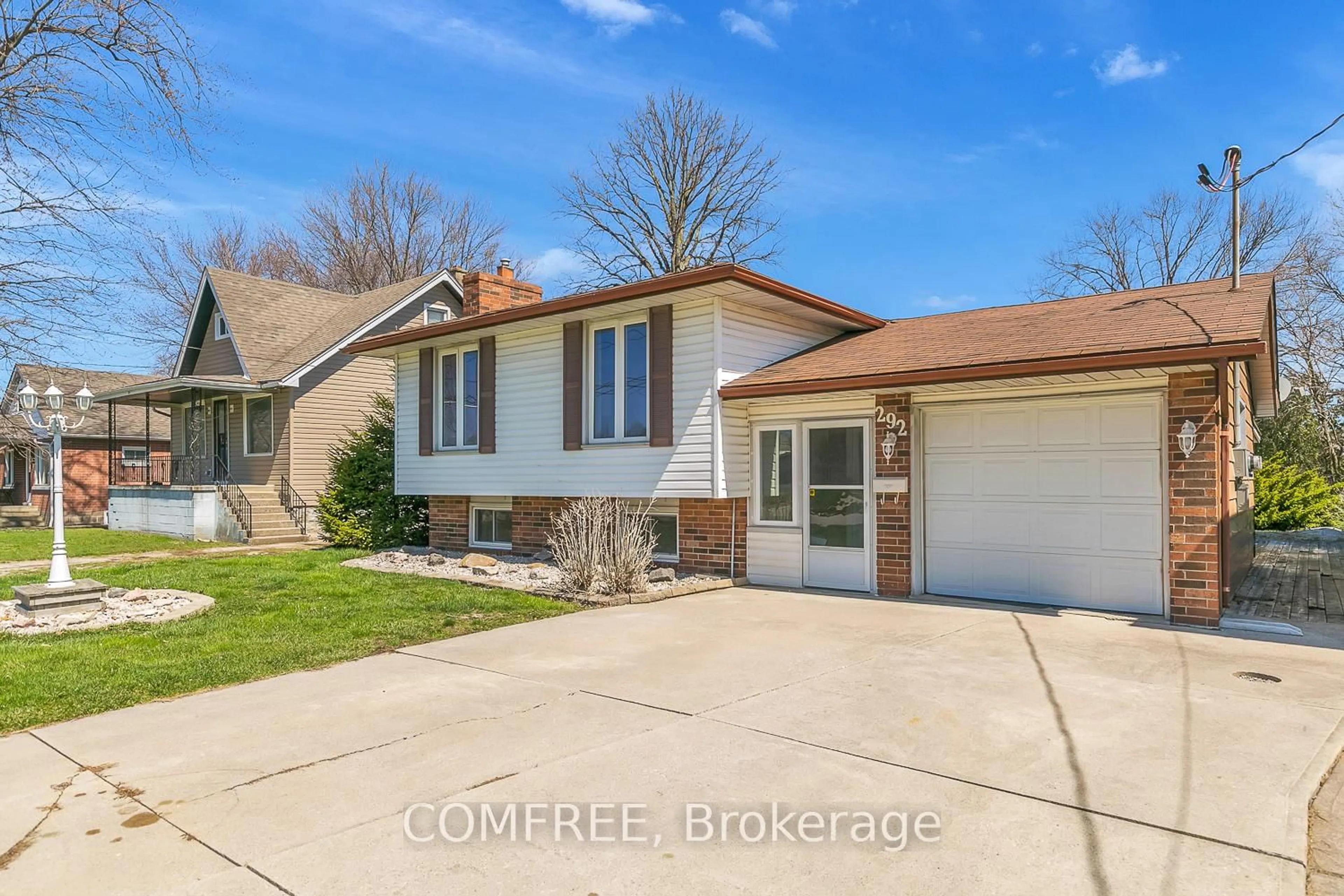 Home with vinyl exterior material, street for 292 Lesperance Rd, Tecumseh Ontario N8N 1W3