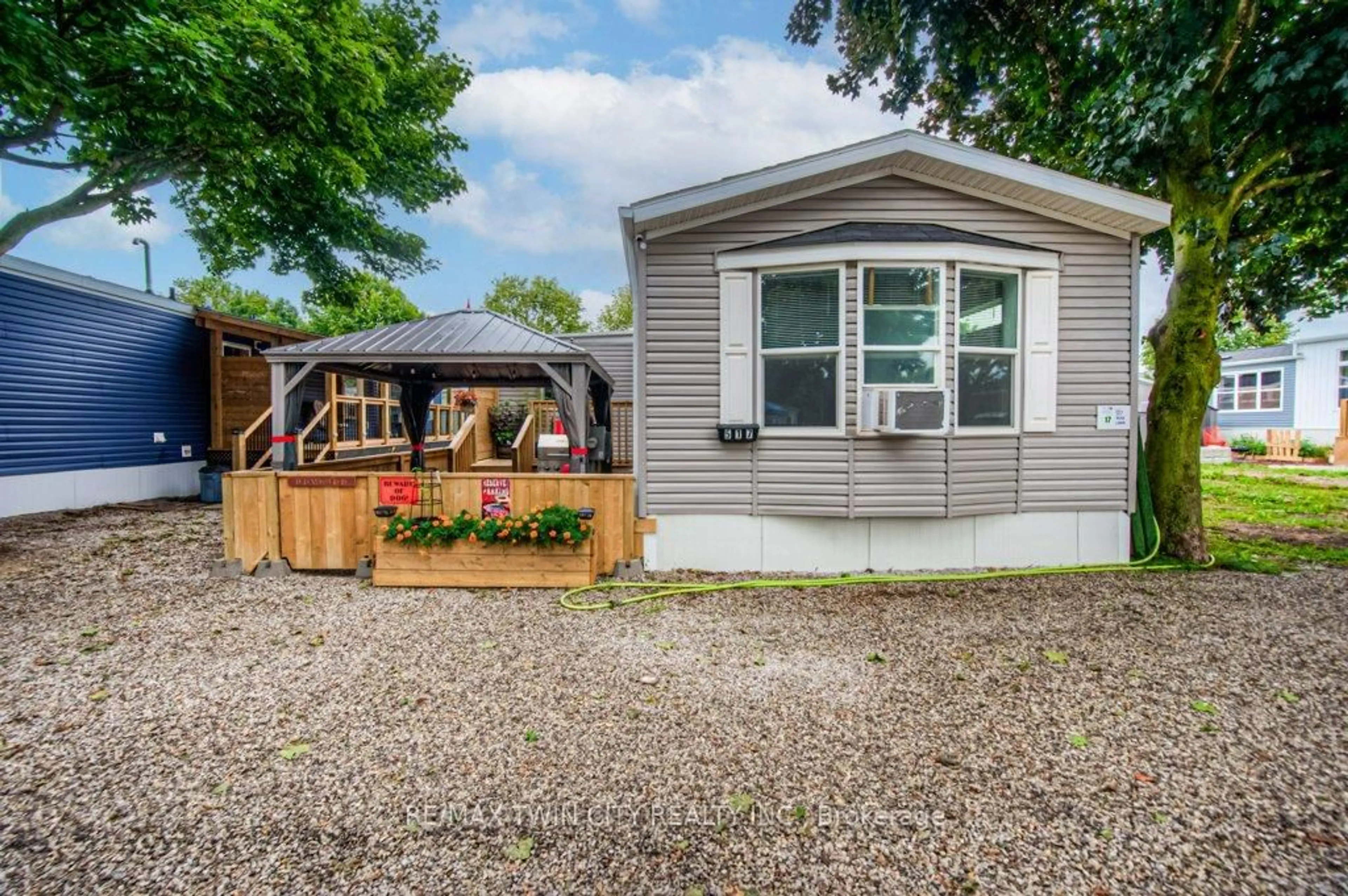 Home with vinyl exterior material, street for 99 Fourth Concession Rd #517, Brant Ontario N0E 1A0