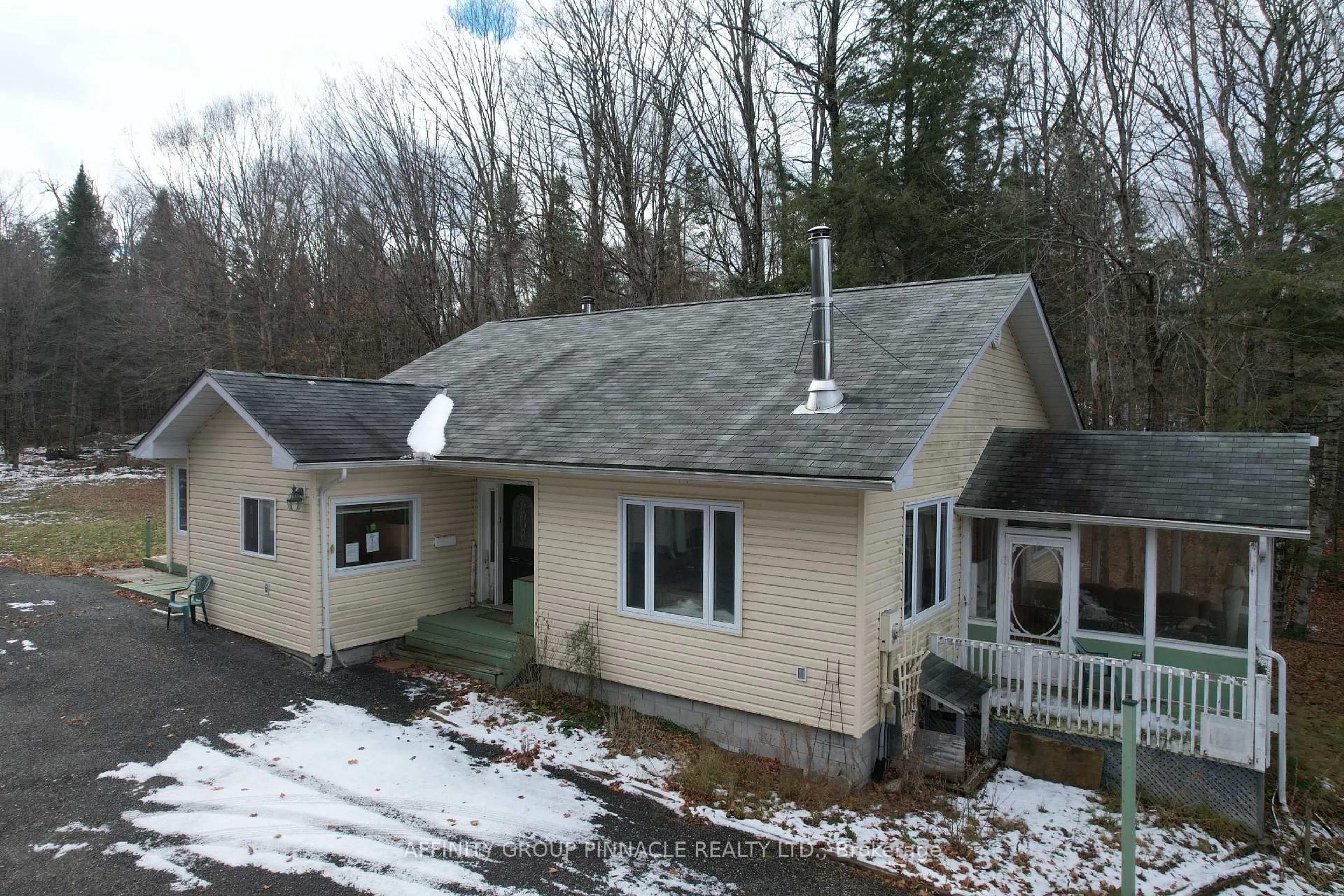 A pic from outside/outdoor area/front of a property/back of a property/a pic from drone, mountain view for 18063 35 Highway, Algonquin Highlands Ontario K0M 1S0