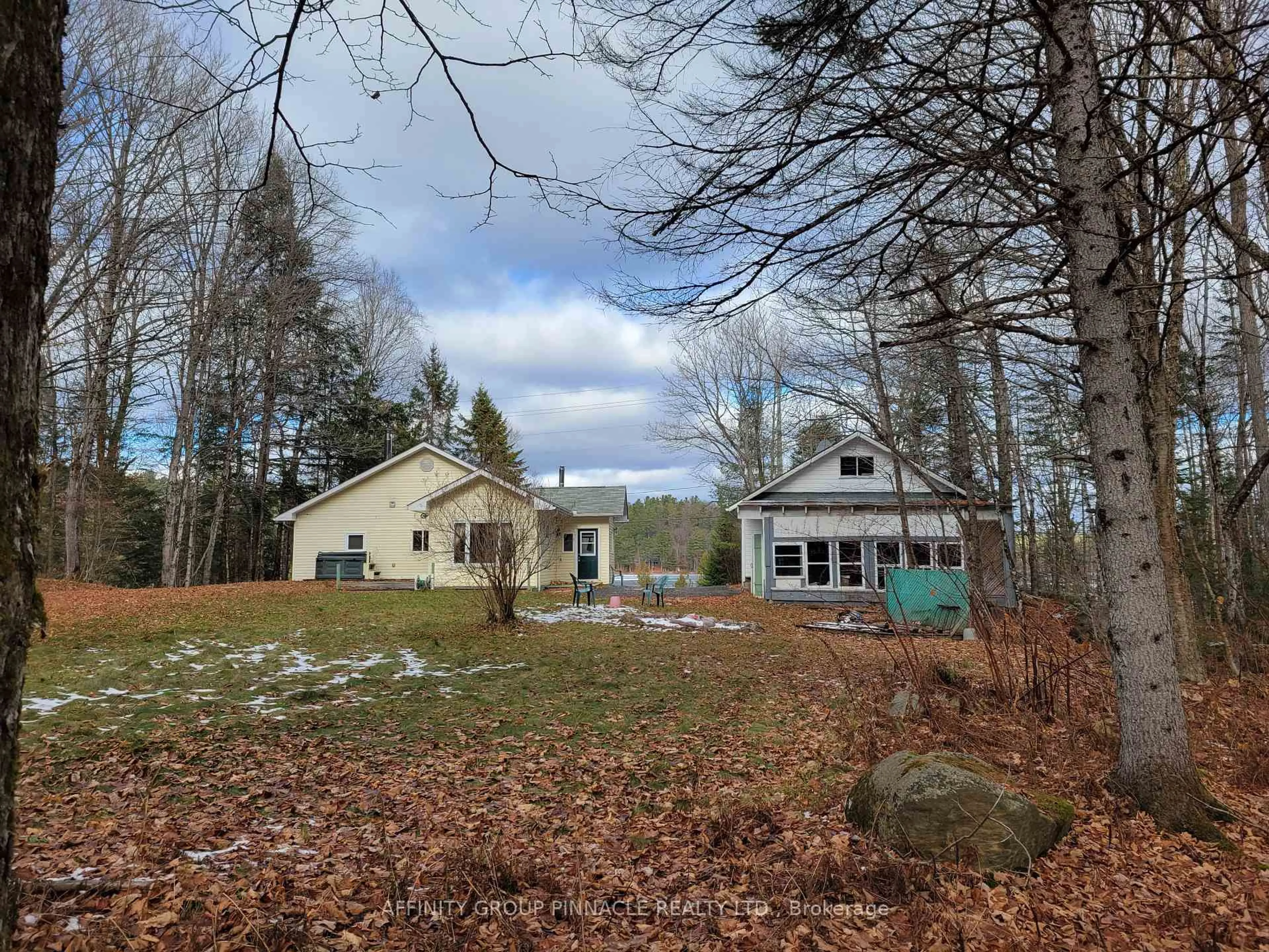 A pic from outside/outdoor area/front of a property/back of a property/a pic from drone, forest/trees view for 18063 35 Highway, Algonquin Highlands Ontario K0M 1S0