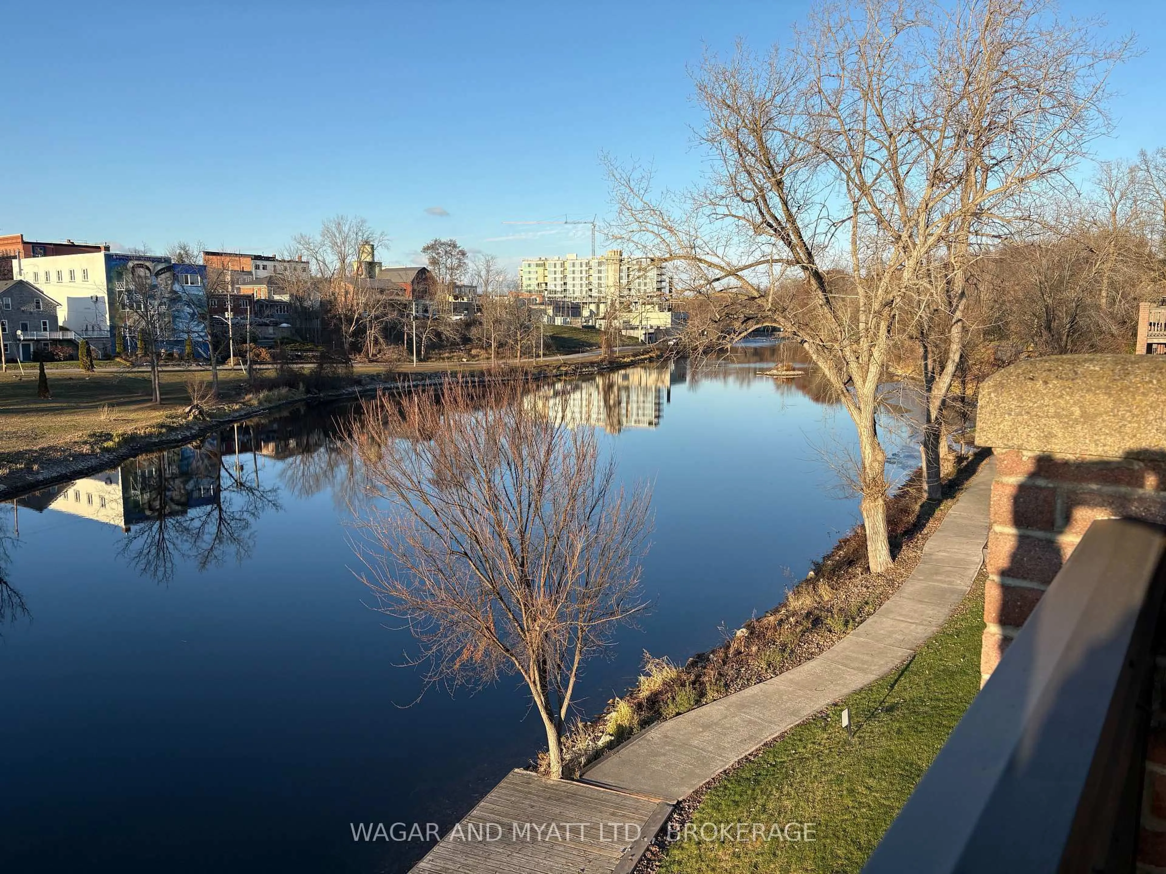 A pic from outside/outdoor area/front of a property/back of a property/a pic from drone, water/lake/river/ocean view for 7 CENTRE St #303, Greater Napanee Ontario K7R 3X3