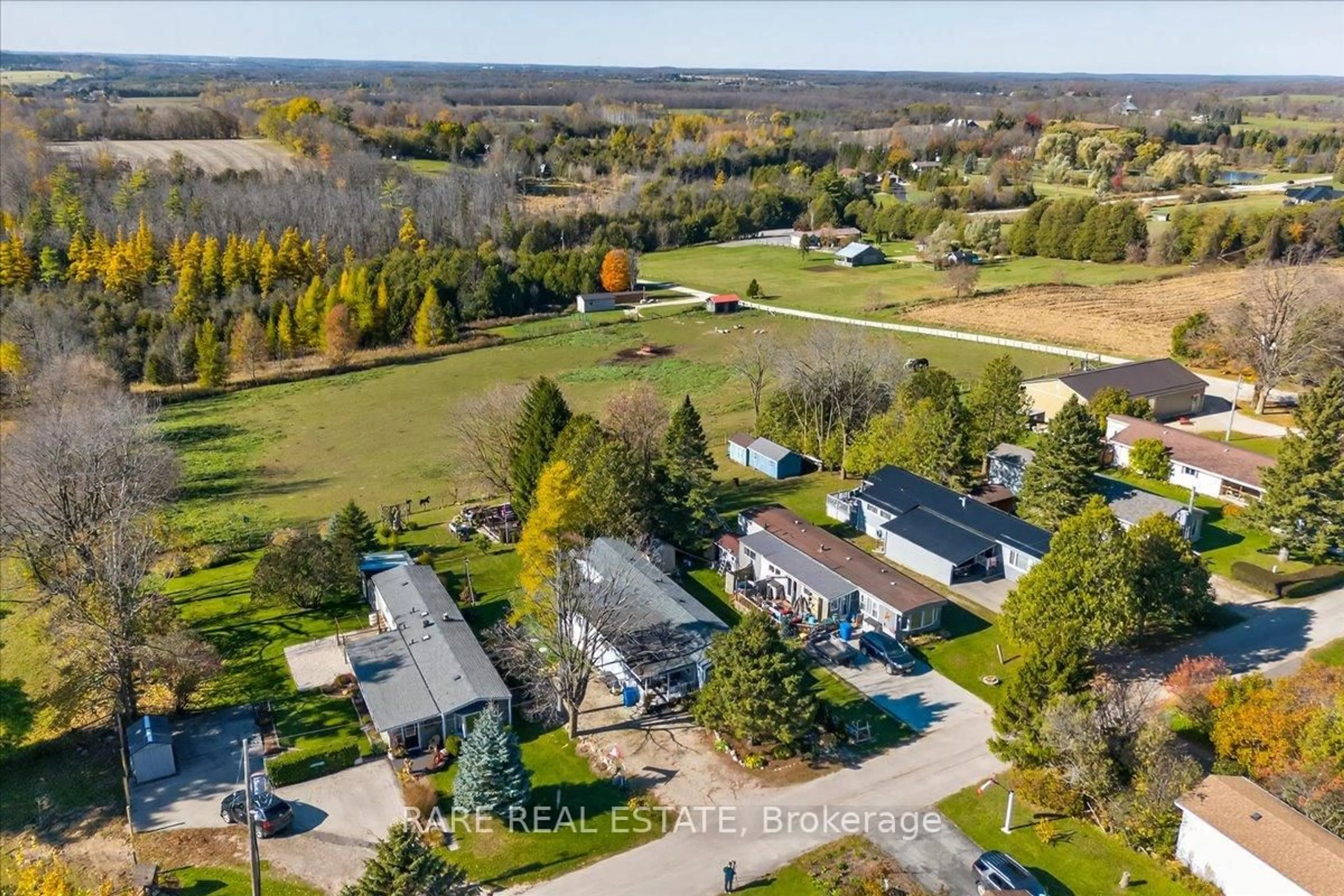 A pic from outside/outdoor area/front of a property/back of a property/a pic from drone, unknown for 302694 Douglas St #61, West Grey Ontario N0G 1R0