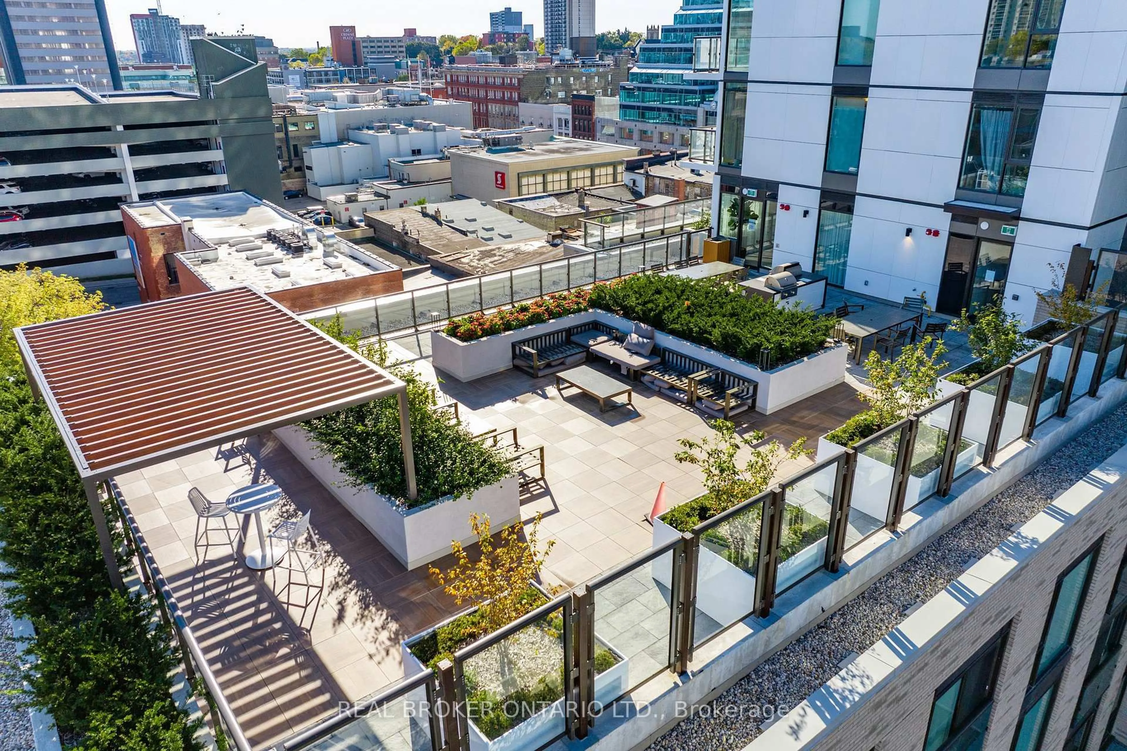 Patio, city buildings view from balcony for 55 Duke St #1210, Kitchener Ontario N2H 0C9