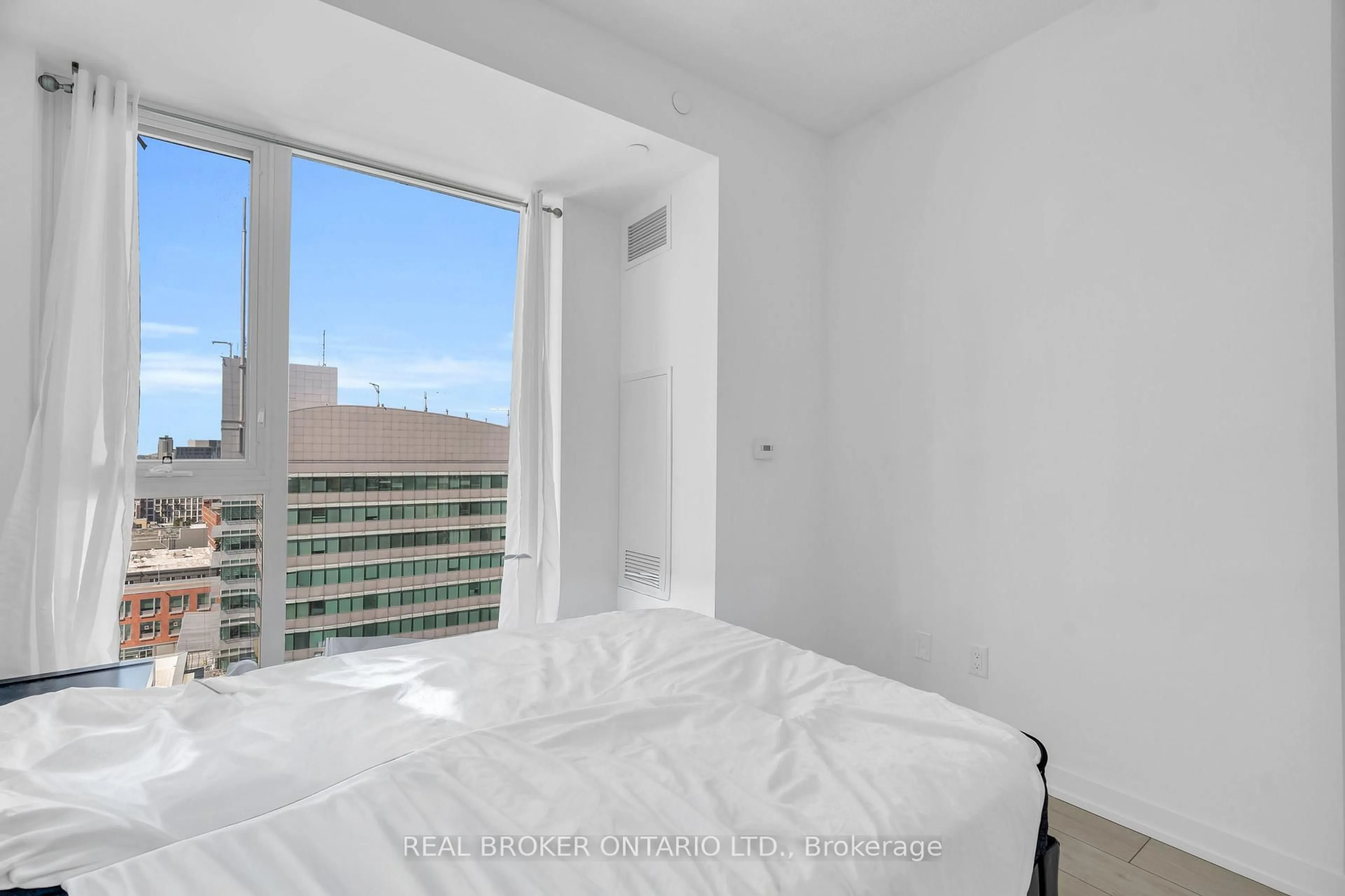 Bedroom with bed, floor is not visible for 55 Duke St #1210, Kitchener Ontario N2H 0C9