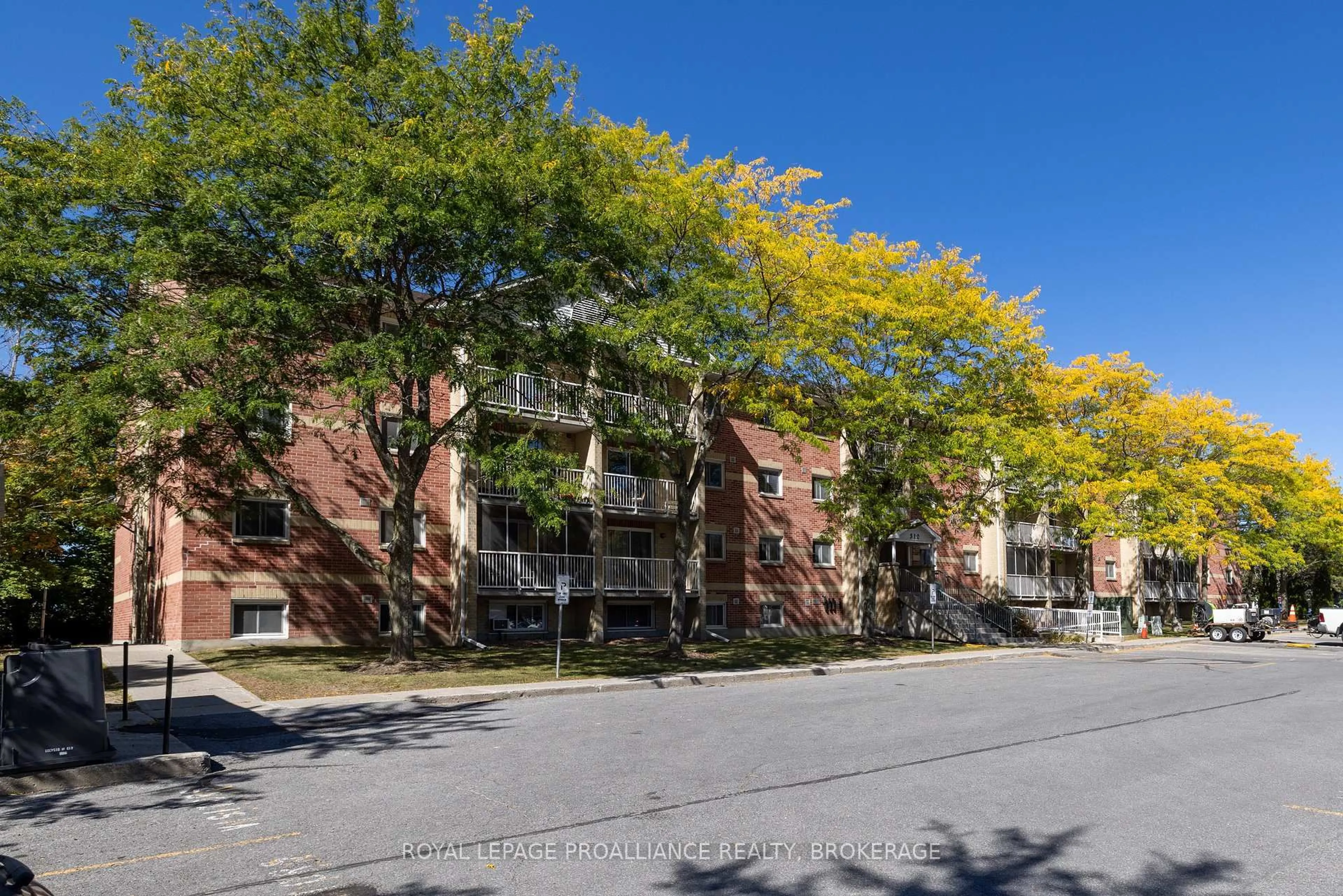 A pic from outside/outdoor area/front of a property/back of a property/a pic from drone, street for 310 Kingsdale Ave #312, Kingston Ontario K7M 8S1