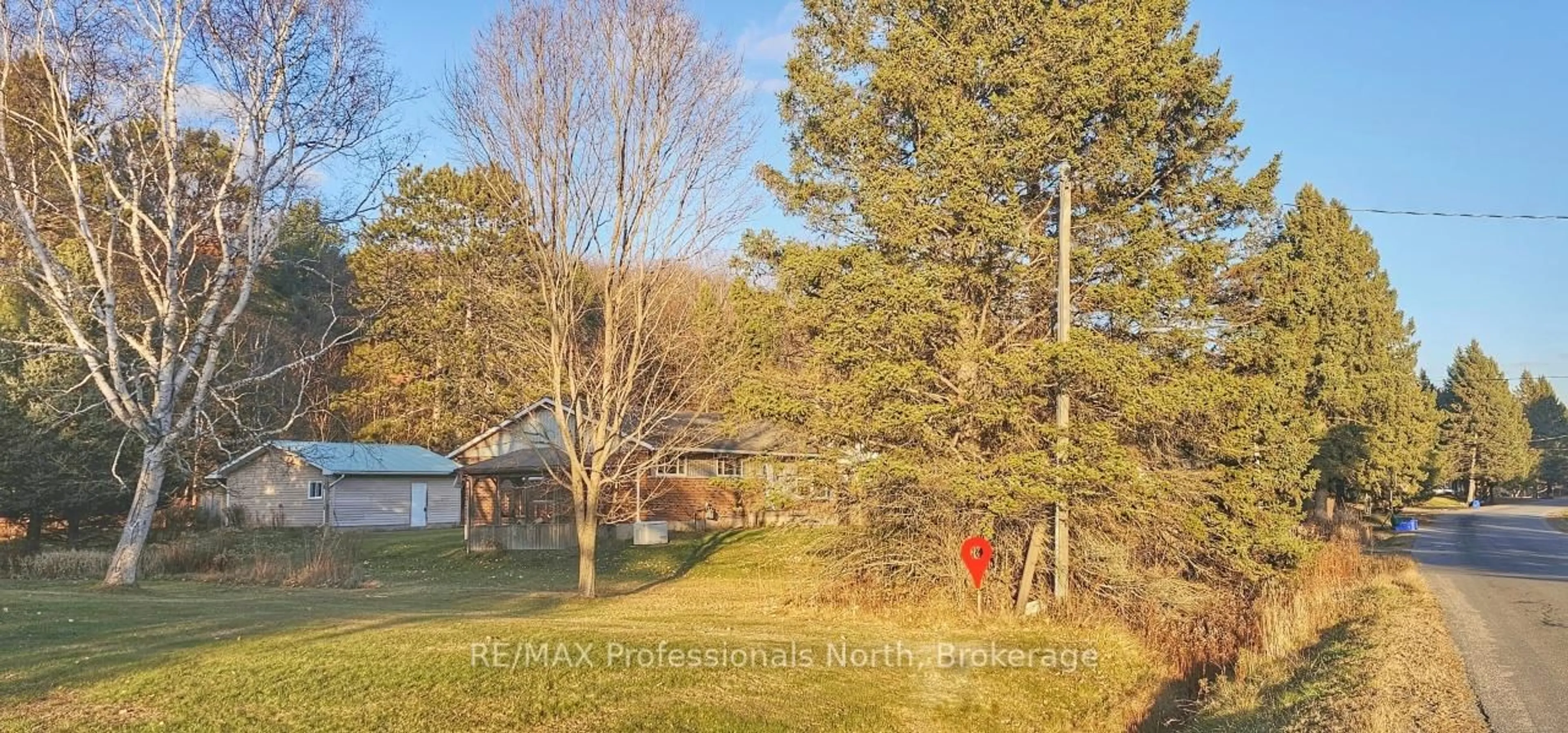 A pic from outside/outdoor area/front of a property/back of a property/a pic from drone, forest/trees view for 62 riverside Dr, Huntsville Ontario P1H 1R6