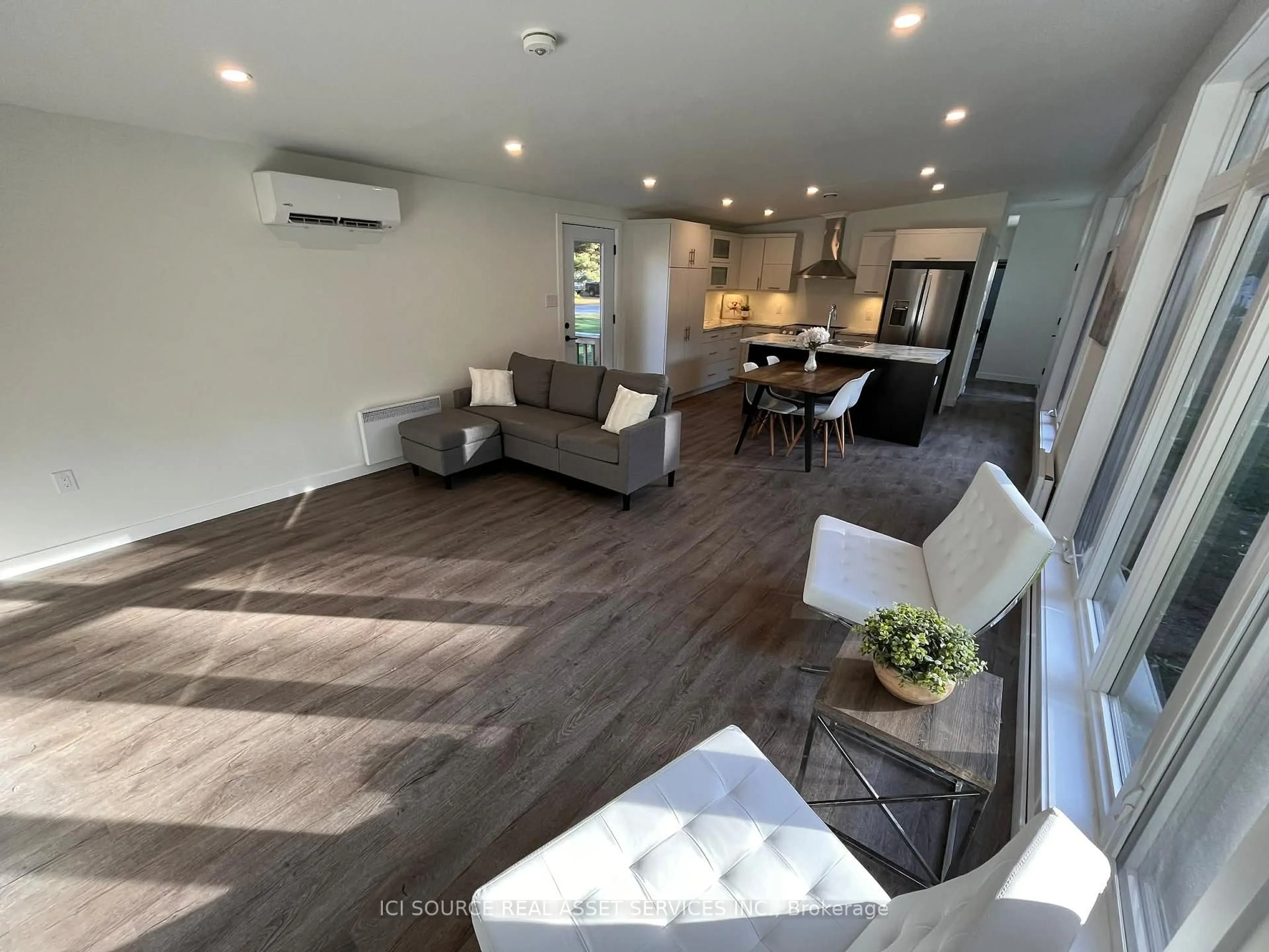 Living room with furniture, wood/laminate floor for 5620 Rockdale Rd #51, Vars Ontario K0A 3H0