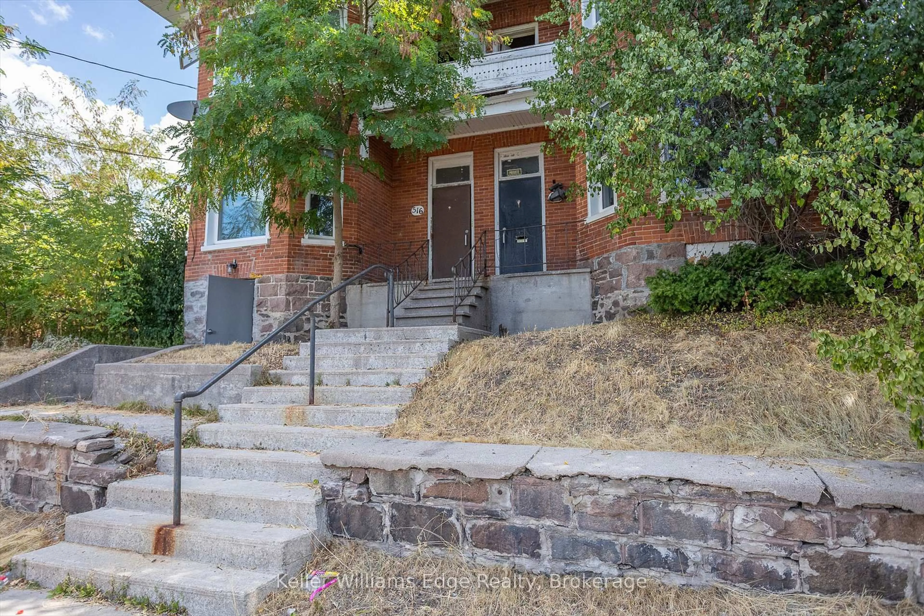 Home with brick exterior material, street for 514-516 Aylmer St, Peterborough Ontario K9H 3W5