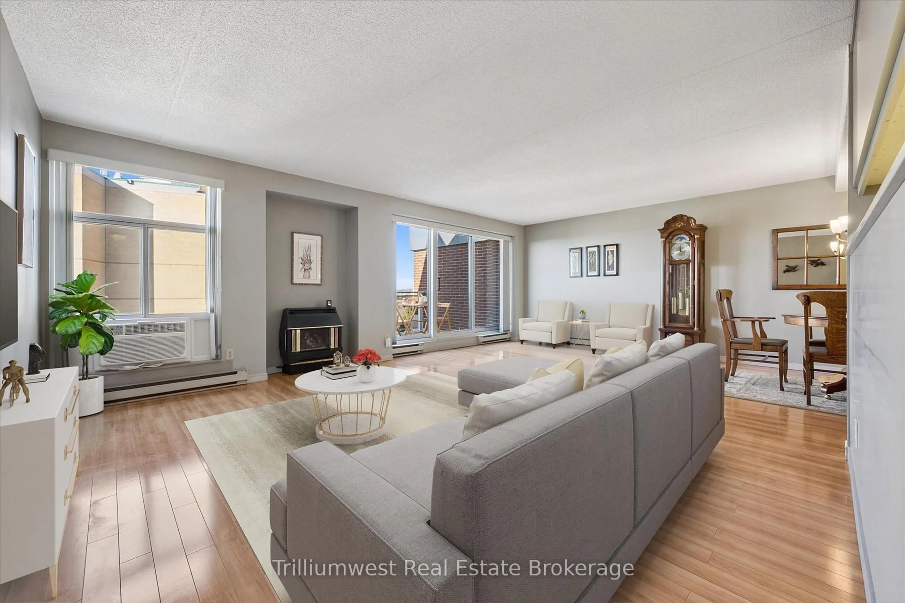 Living room with furniture, wood/laminate floor for 8 Christopher Crt #705, Guelph Ontario N1G 4N7