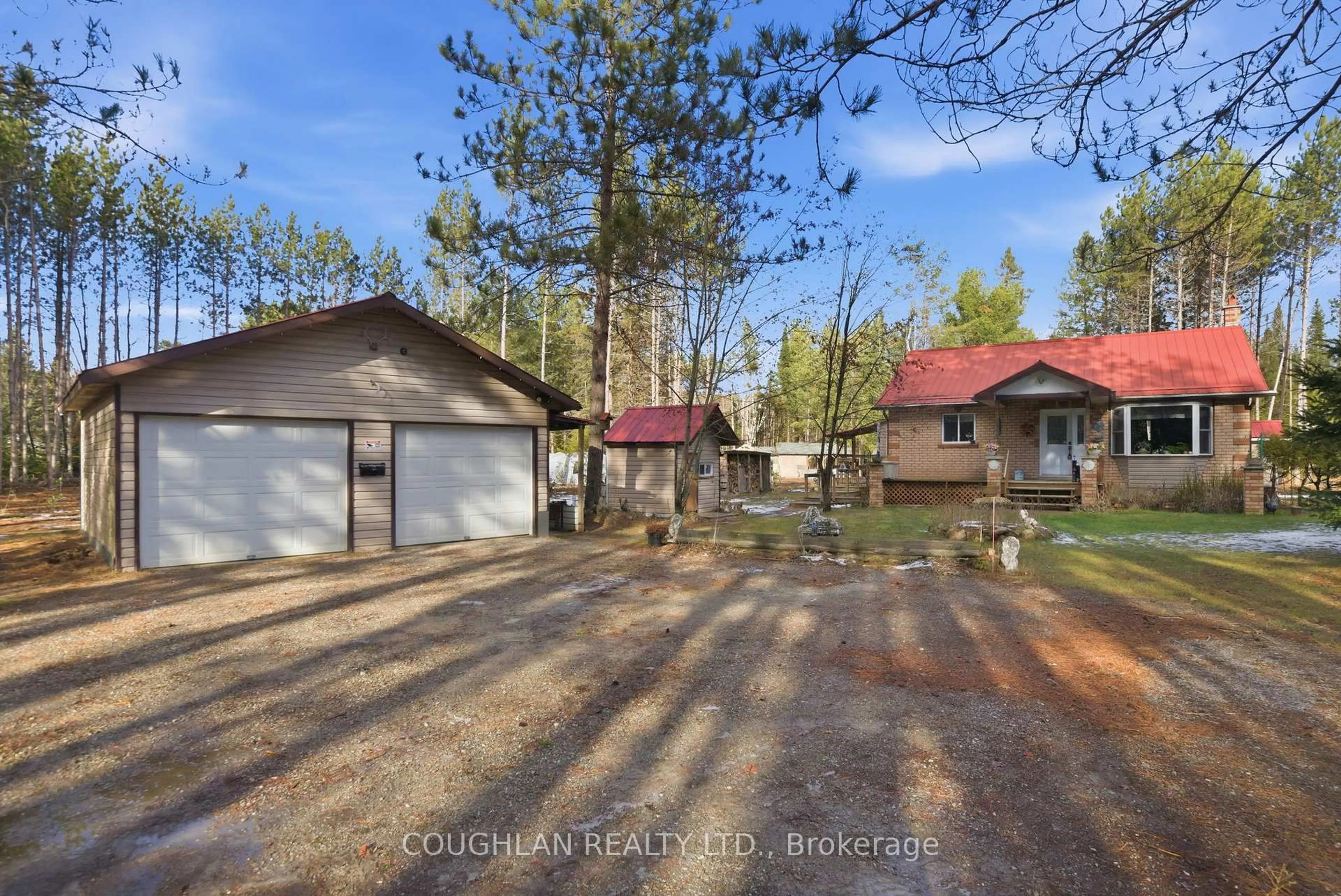 A pic from outside/outdoor area/front of a property/back of a property/a pic from drone, forest/trees view for 1055 Irondale Rd, Minden Hills Ontario K0M 2A1