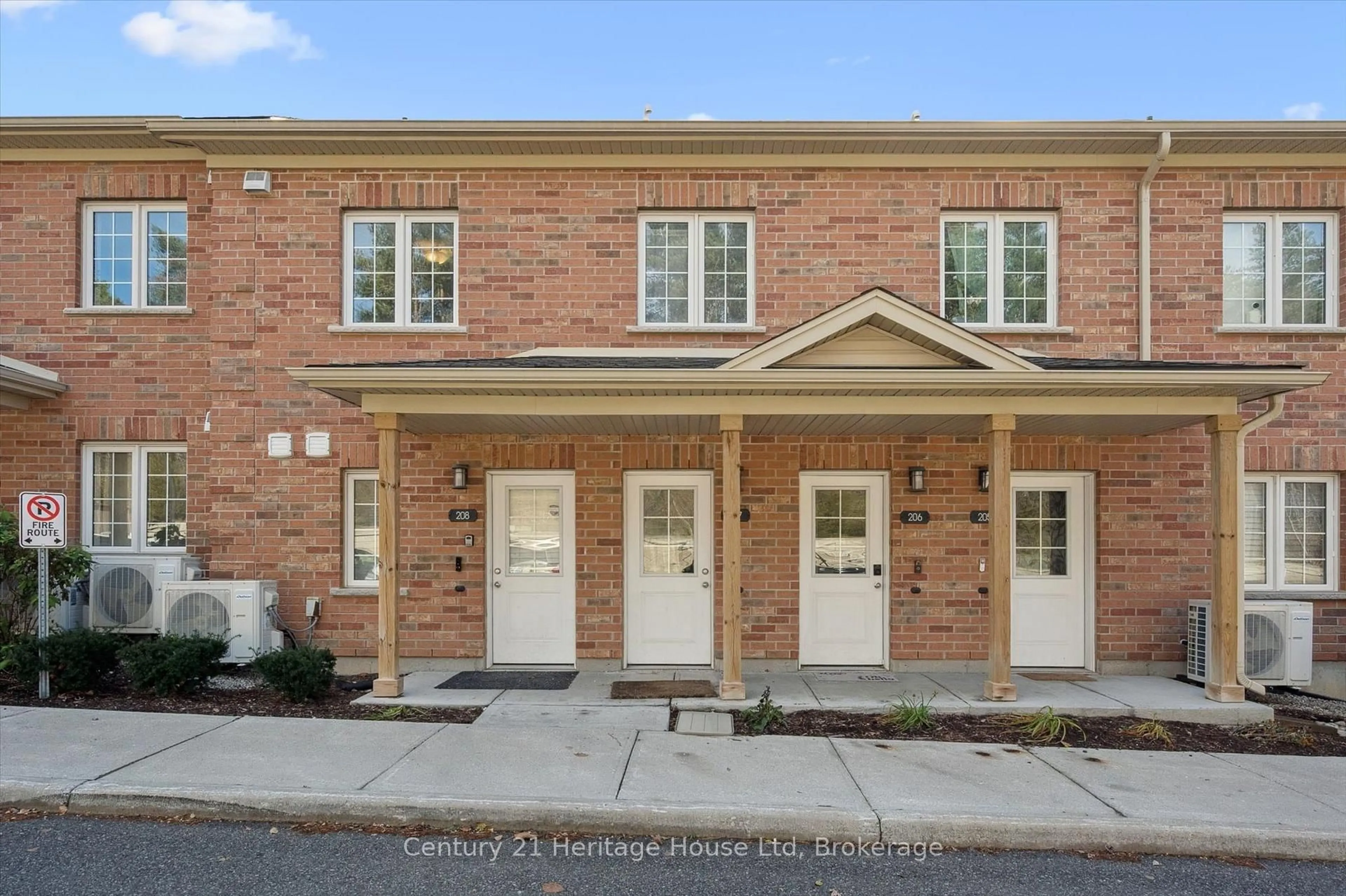 Home with brick exterior material, street for 7 Cityview Dr #207, Guelph Ontario N1E 0R1