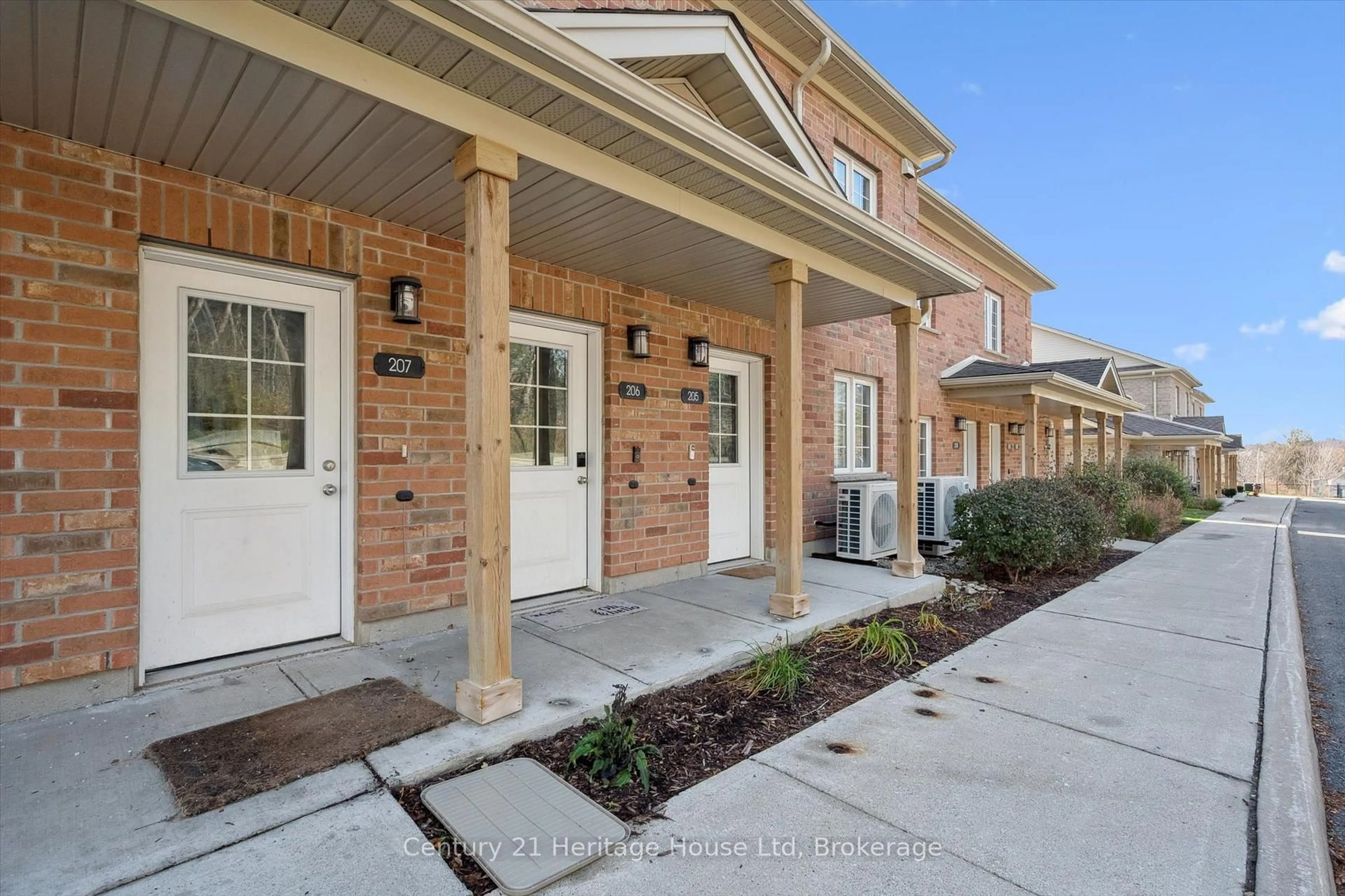 Home with brick exterior material, street for 7 Cityview Dr #207, Guelph Ontario N1E 0R1