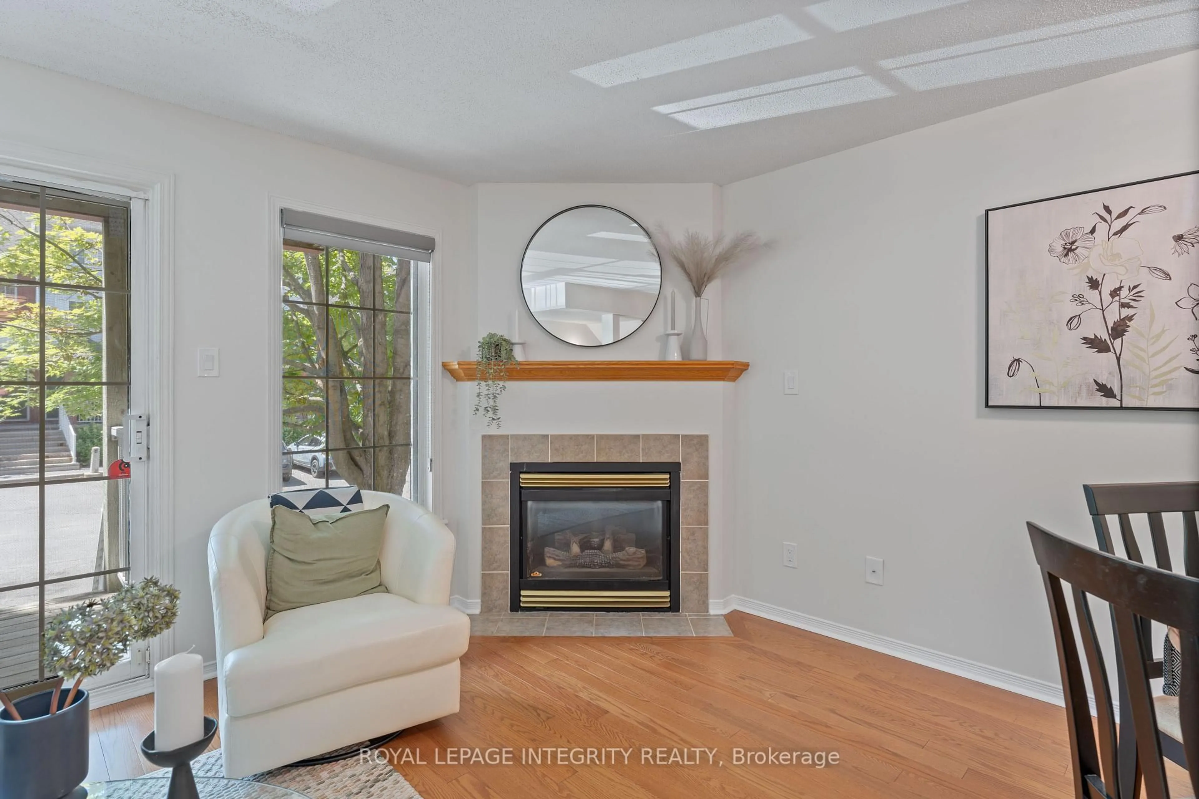Living room with furniture, wood/laminate floor for 108 Centrepointe Dr #E, Ottawa Ontario K2G 6K3