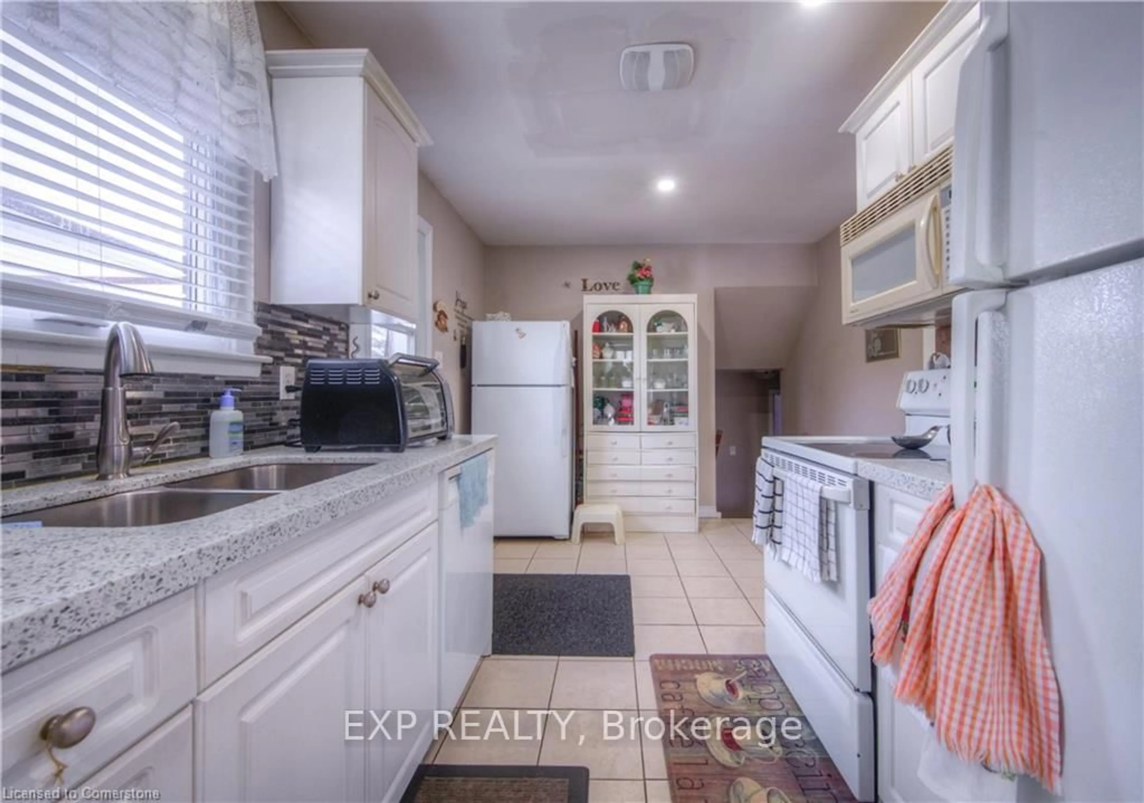 Kitchen with laundary machines, ceramic/tile floor for 74 Markwood Dr, Kitchener Ontario N2M 2H6