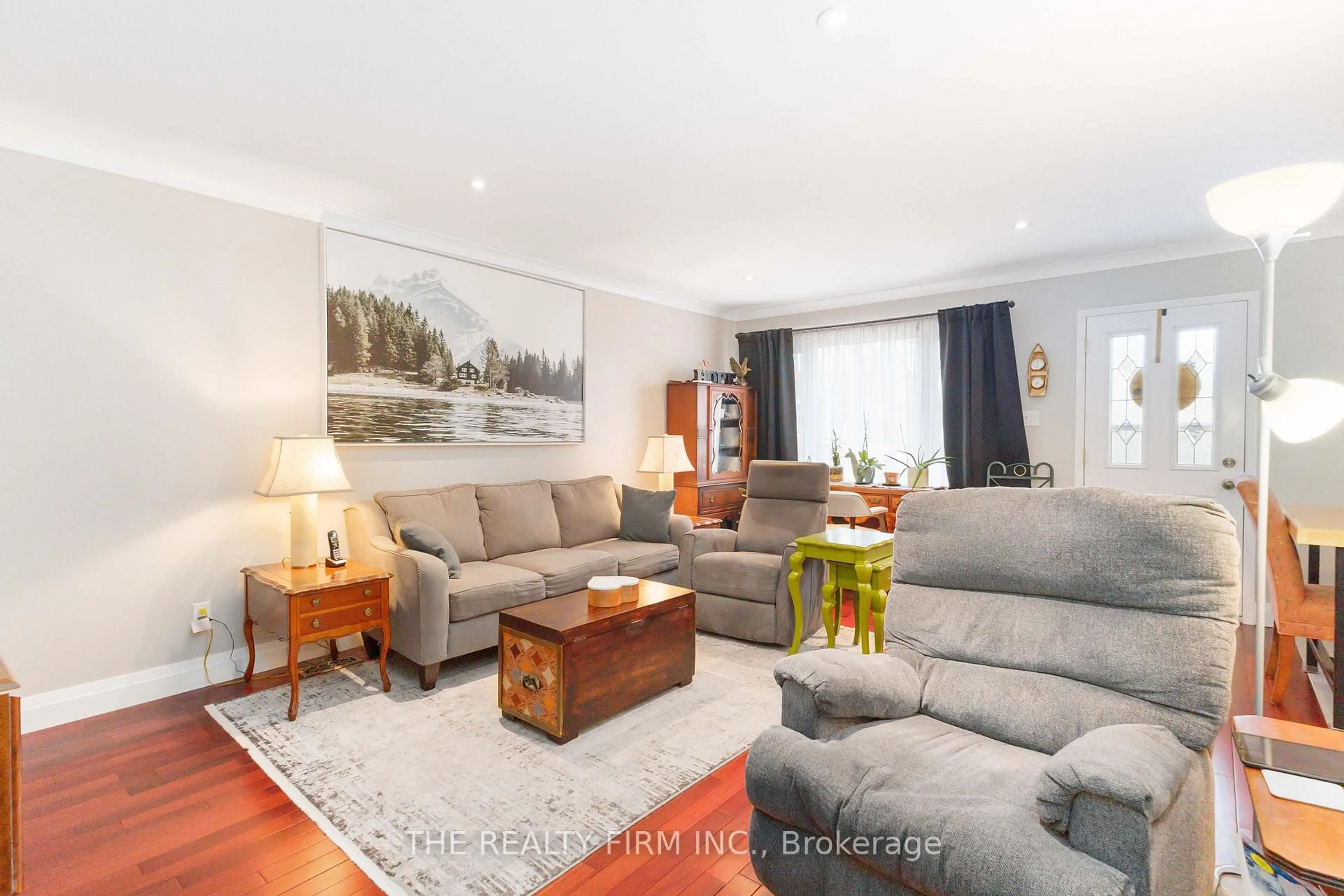 Living room with furniture, wood/laminate floor for 72 Metcalfe Cres, London South Ontario N6E 1H9