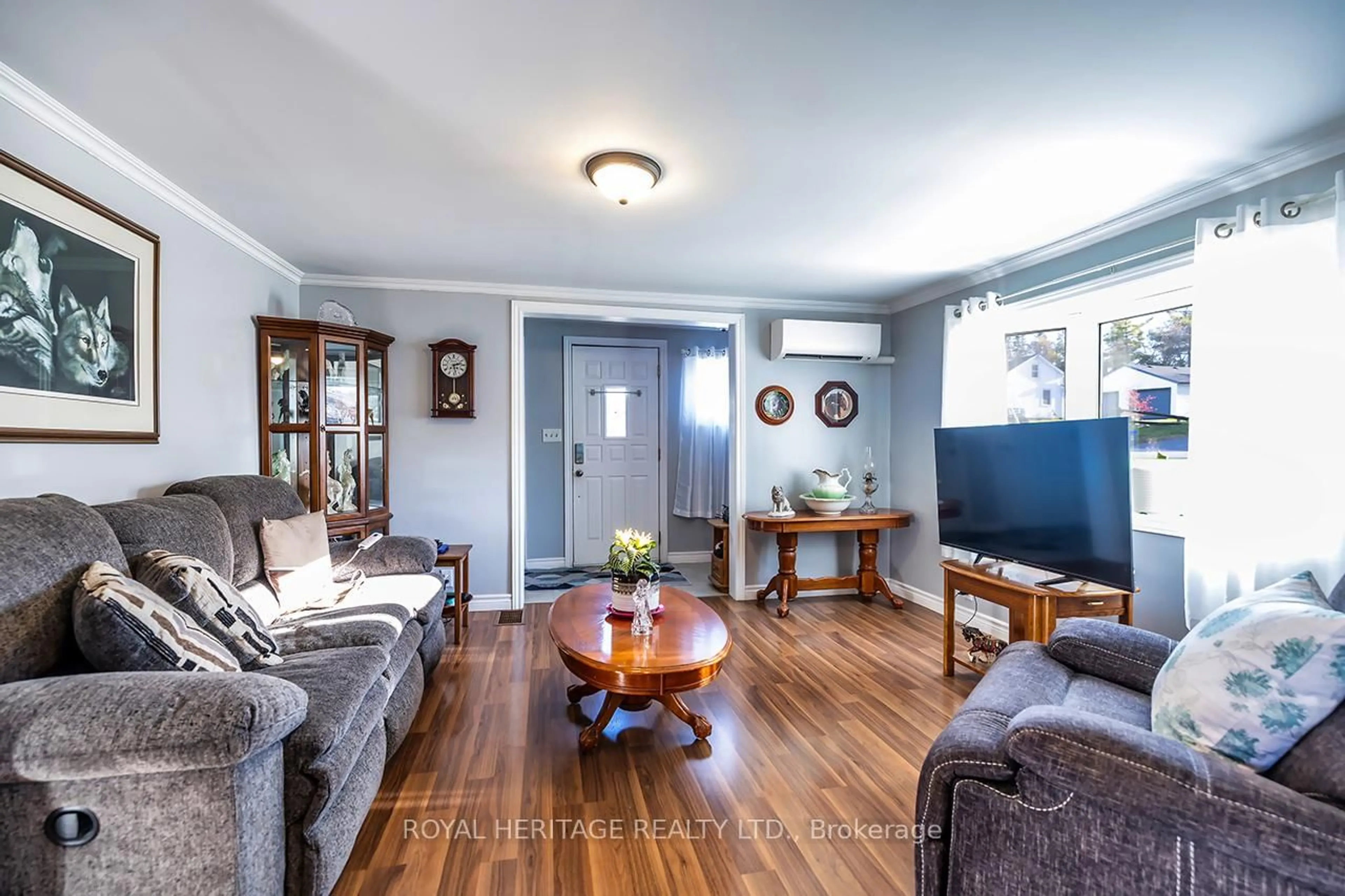 Living room with furniture, wood/laminate floor for 5073 Oak St, Hamilton Township Ontario K0L 1E0