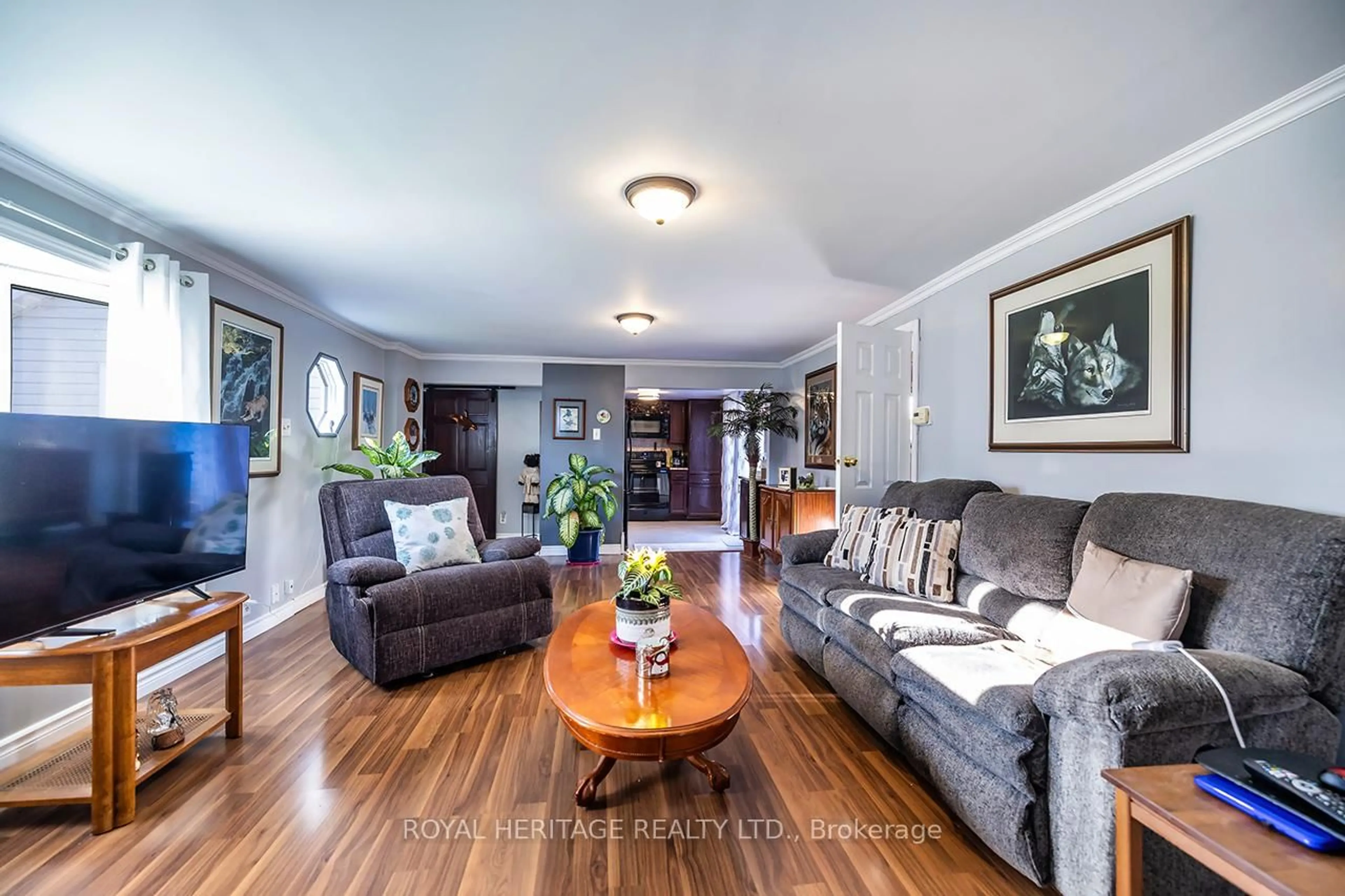 Living room with furniture, wood/laminate floor for 5073 Oak St, Hamilton Township Ontario K0L 1E0