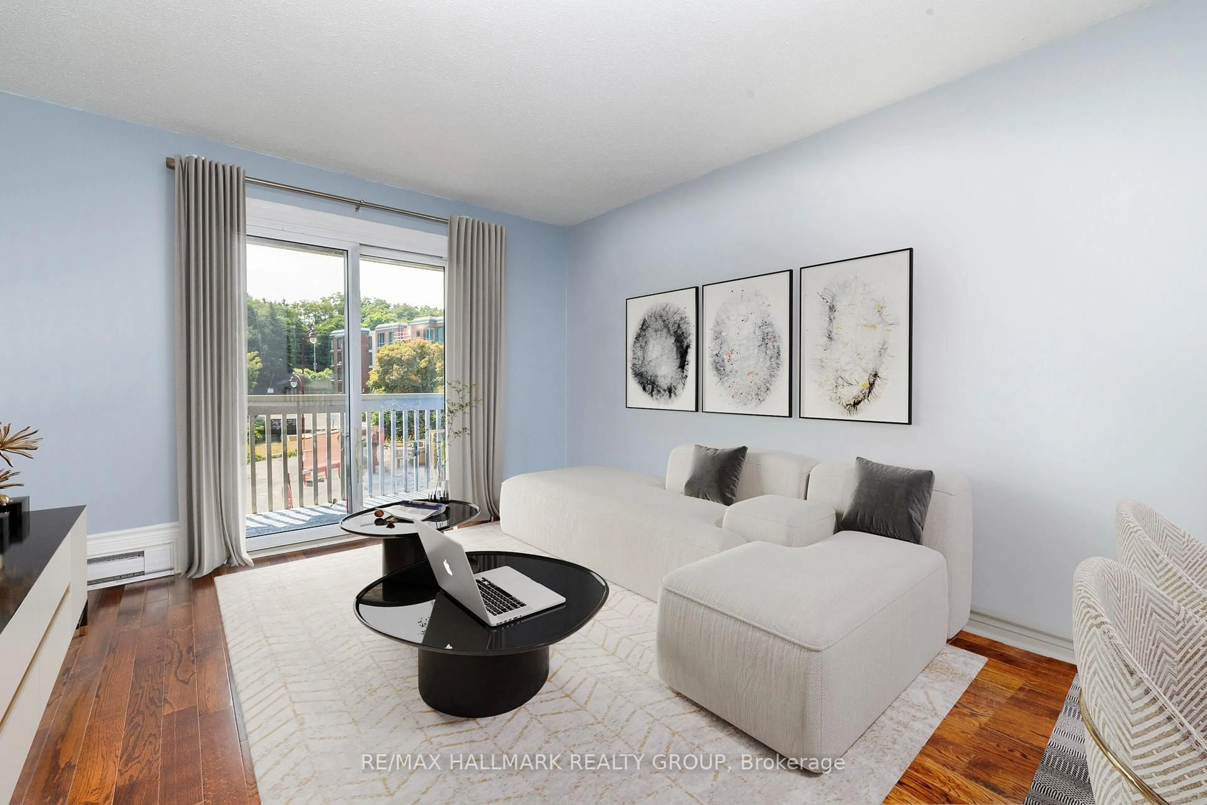 Living room with furniture, wood/laminate floor for 345 Centrum Blvd #203, Ottawa Ontario K1E 3W9