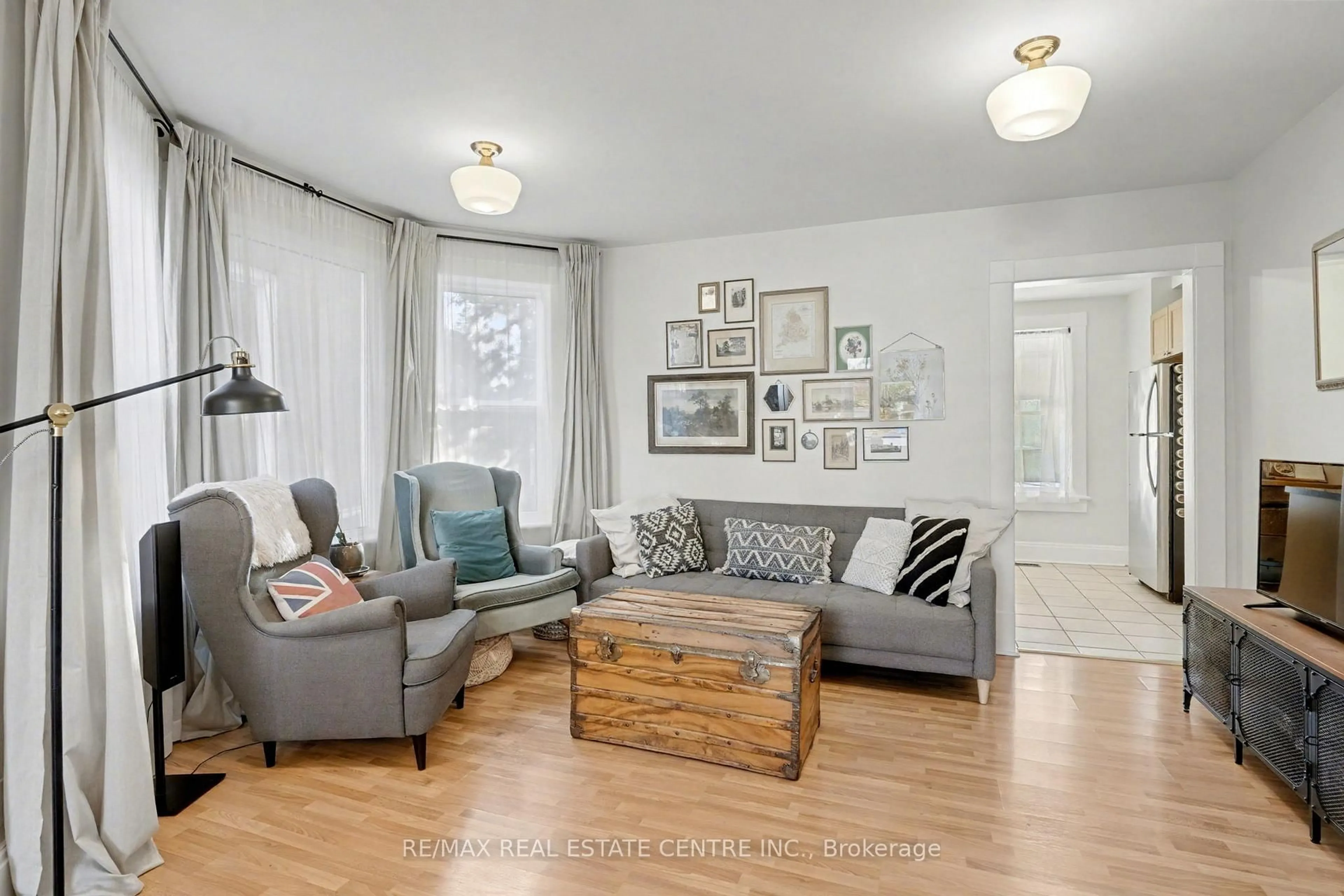 Living room with furniture, wood/laminate floor for 60 Rife Ave, Cambridge Ontario N3C 2G7