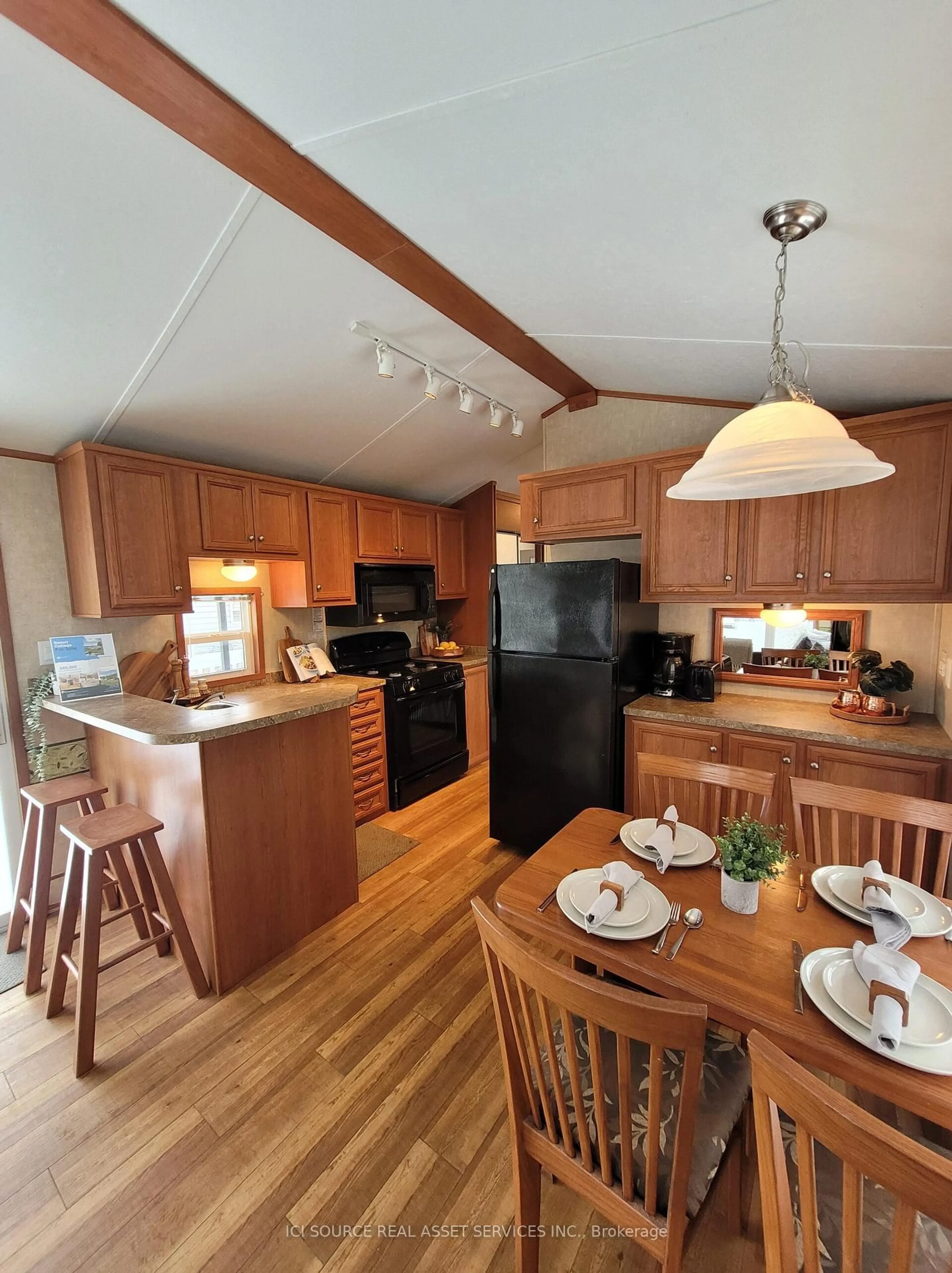 Open concept kitchen, wood/laminate floor for 171 Woodland Estates Rd #CPC007, Trent Hills Ontario K0L 1L0