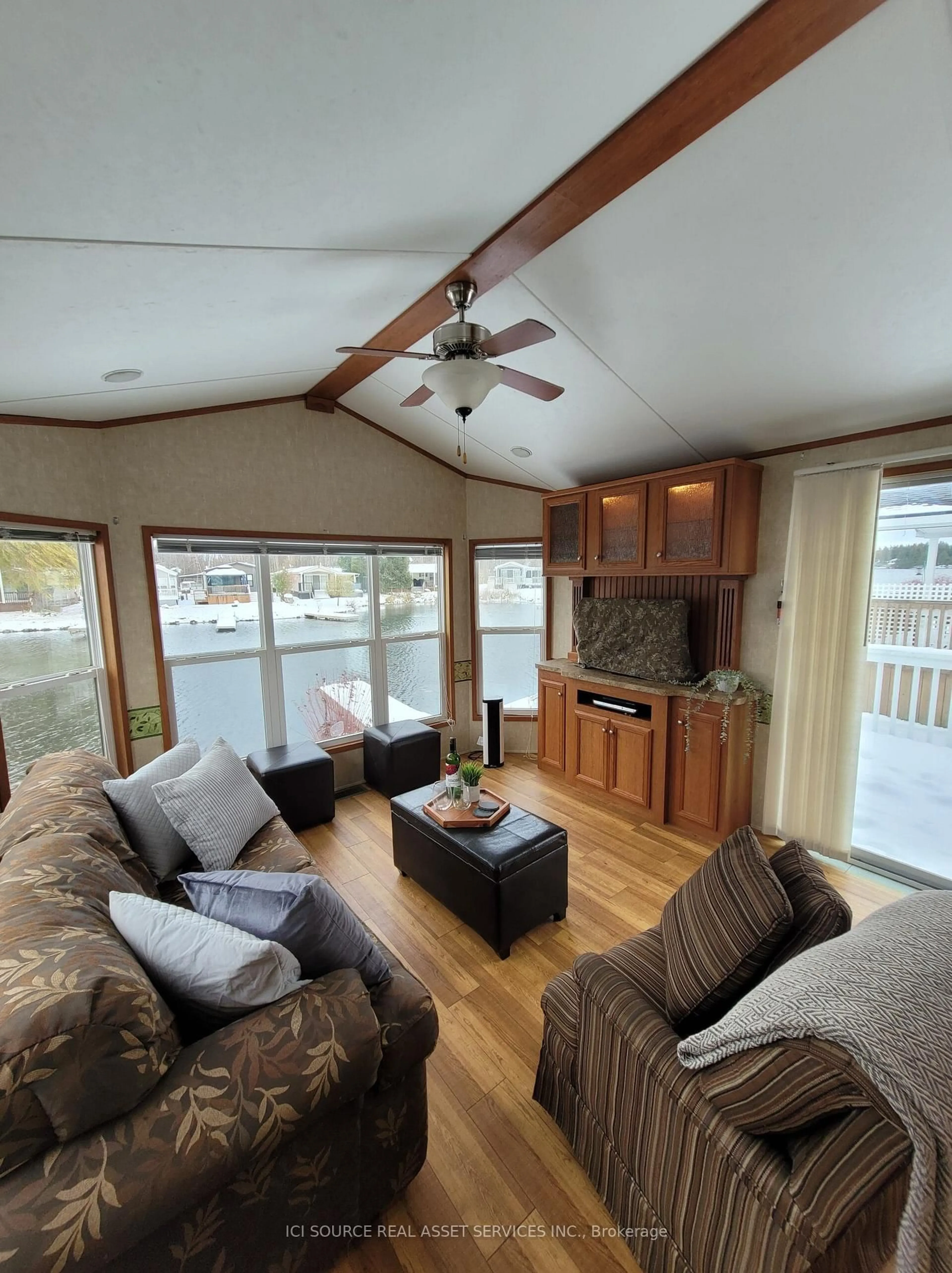 Living room with furniture, wood/laminate floor for 171 Woodland Estates Rd #CPC007, Trent Hills Ontario K0L 1L0