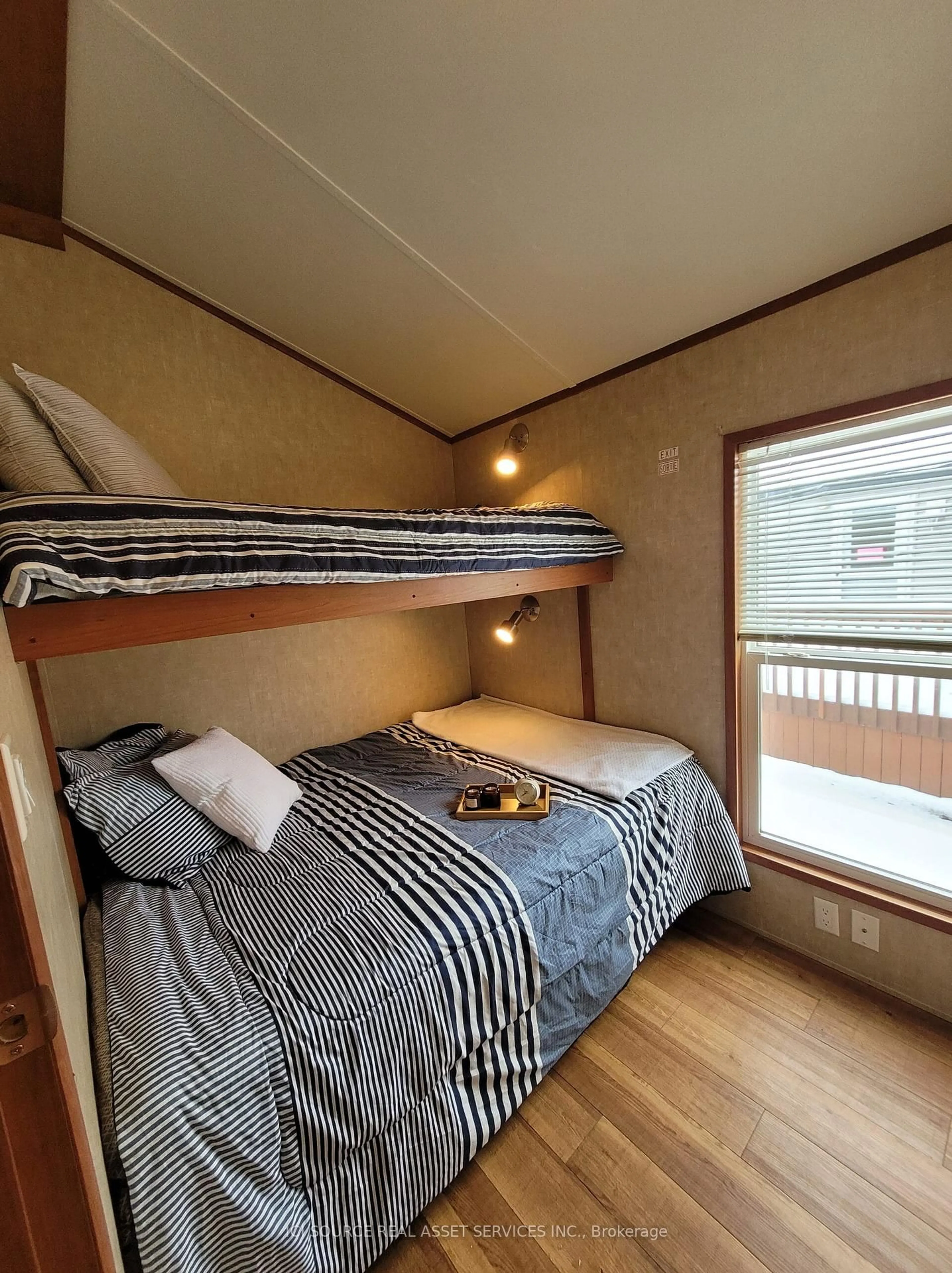 Bedroom with bed, wood/laminate floor for 171 Woodland Estates Rd #CPC007, Trent Hills Ontario K0L 1L0