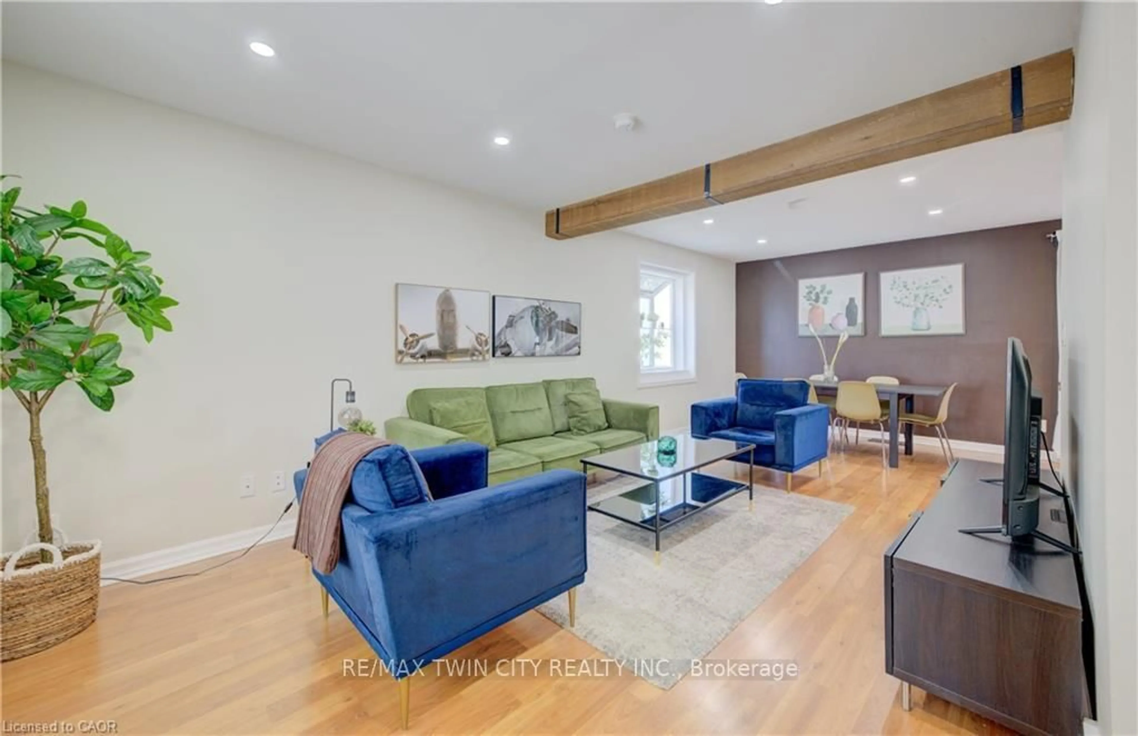 Living room with furniture, wood/laminate floor for 350 Victoria St, Kitchener Ontario N2M 3A5