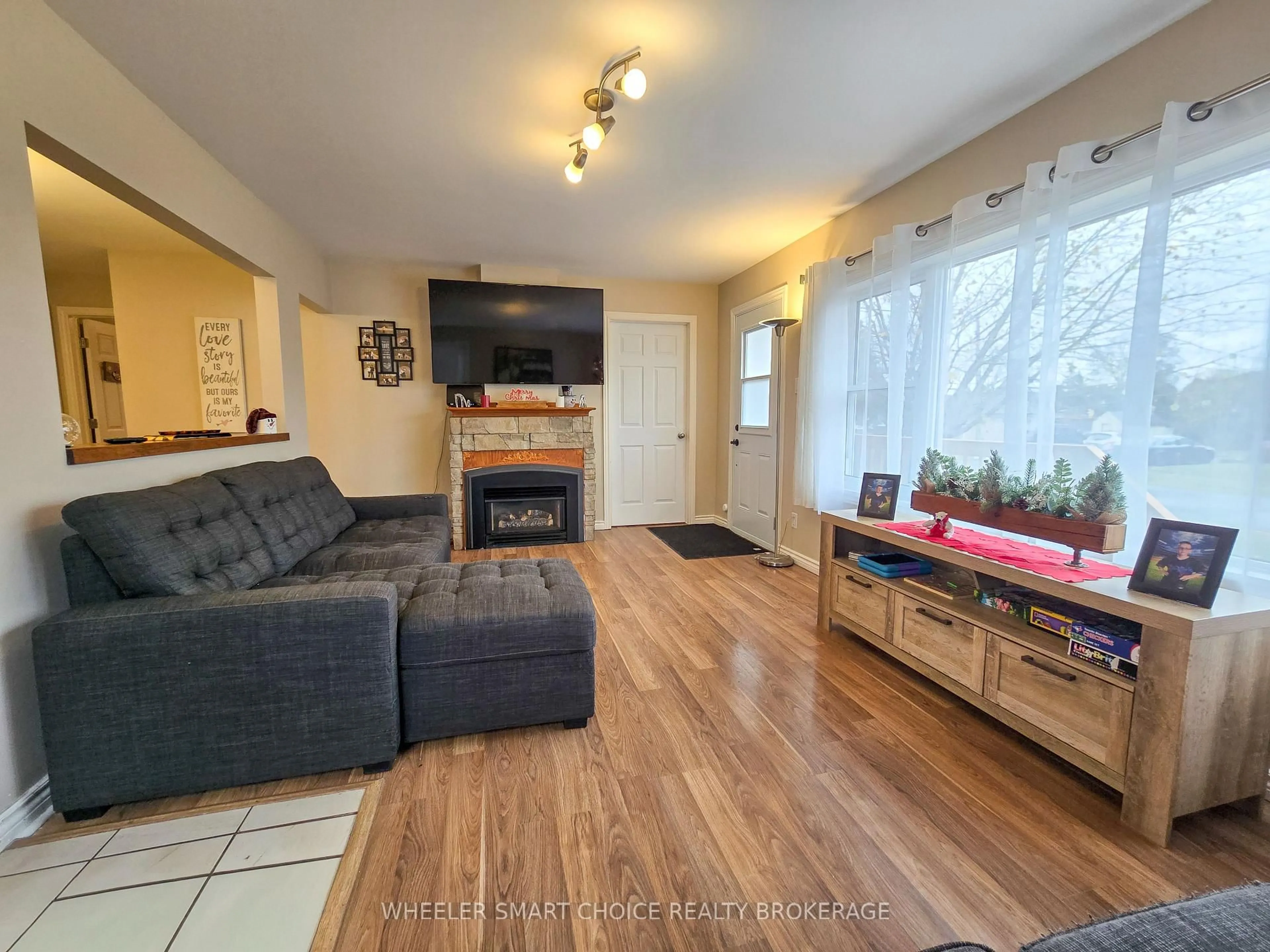 Living room with furniture, wood/laminate floor for 17 Adam Dixon Ave, South Stormont Ontario K0C 1P0