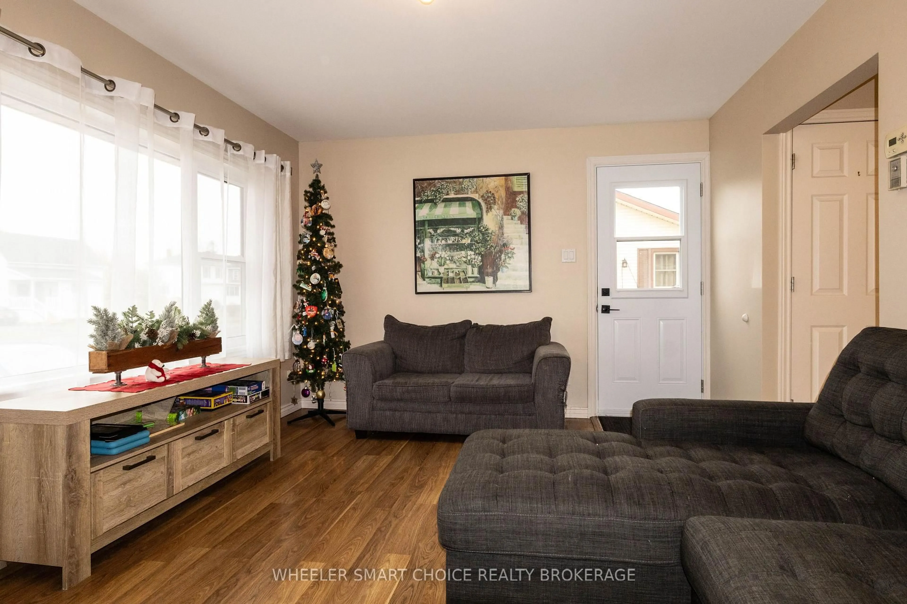 Living room with furniture, wood/laminate floor for 17 Adam Dixon Ave, South Stormont Ontario K0C 1P0