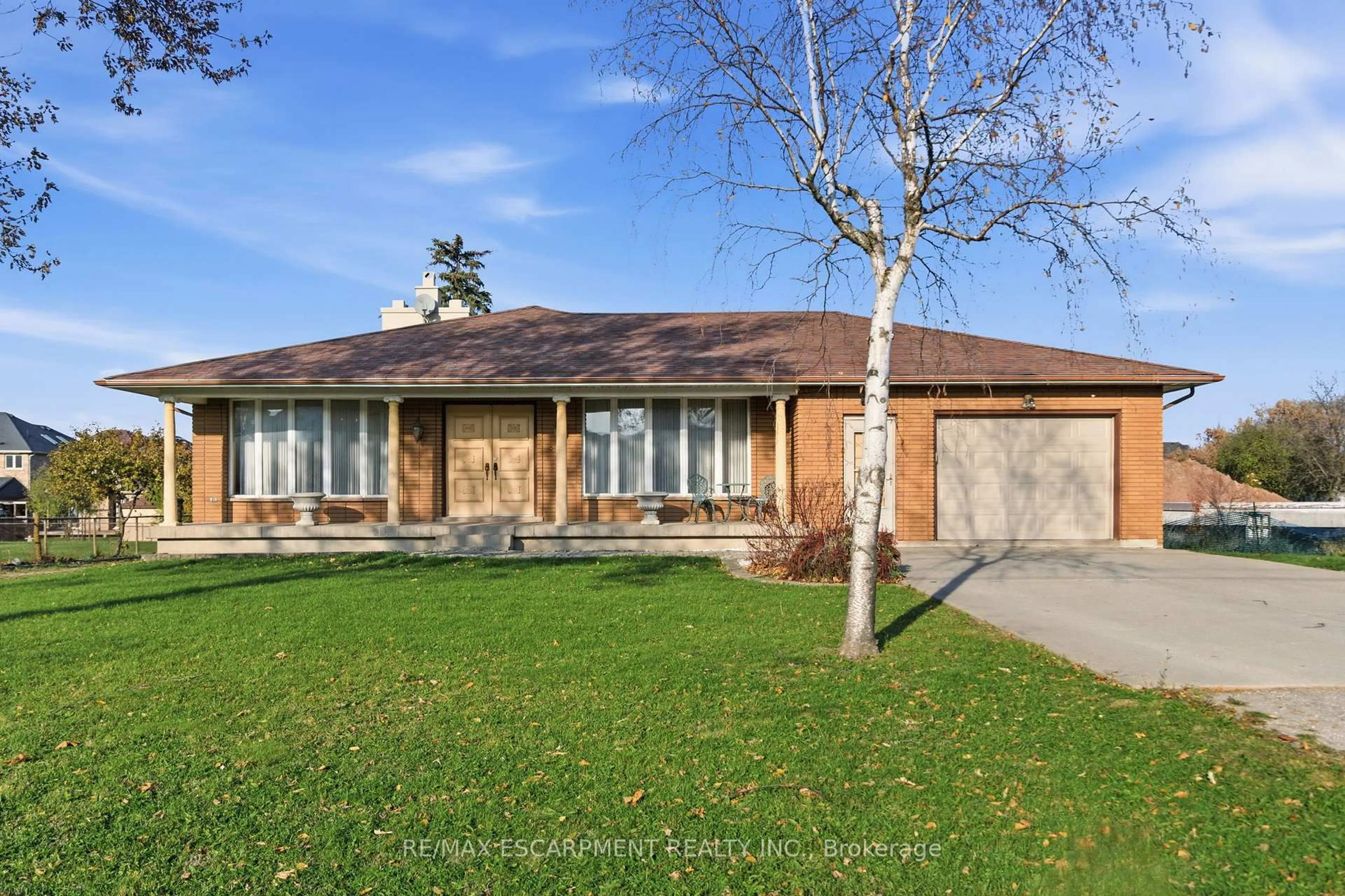 Home with brick exterior material, street for 1235 Barton St, Hamilton Ontario L8E 5G9