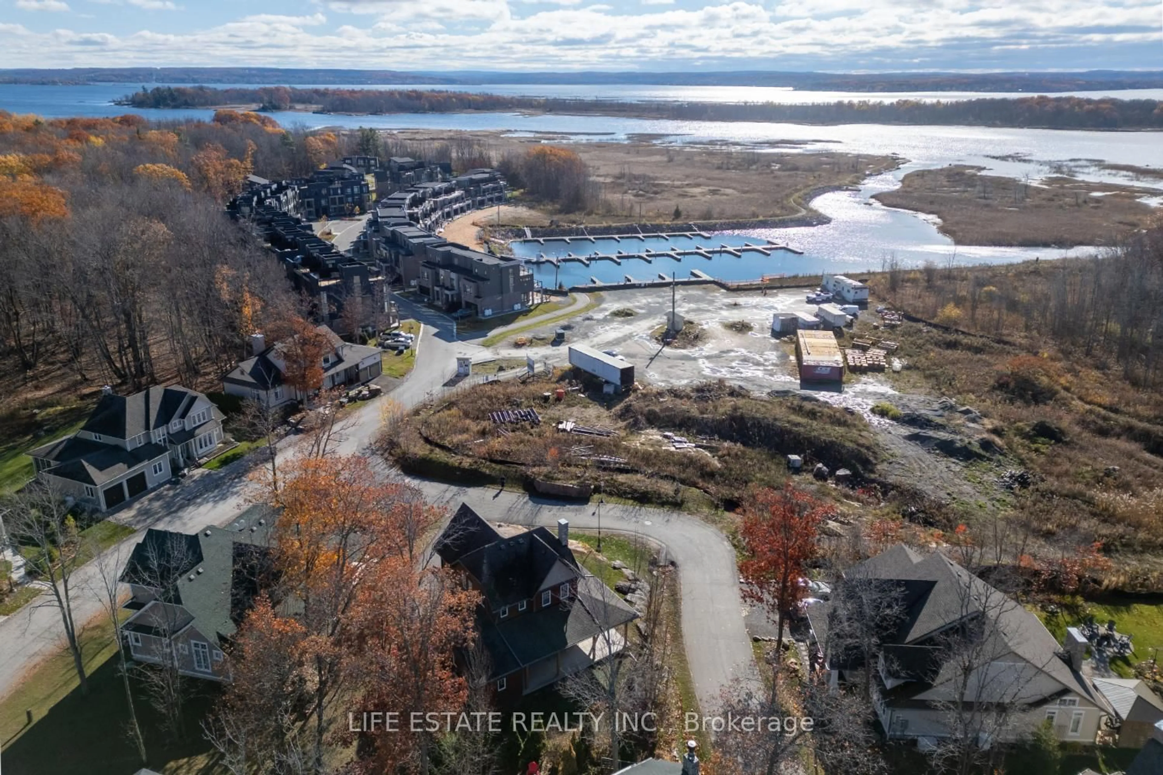 A pic from outside/outdoor area/front of a property/back of a property/a pic from drone, water/lake/river/ocean view for 39 Country Tr #20, Georgian Bay Ontario L0K 1S0
