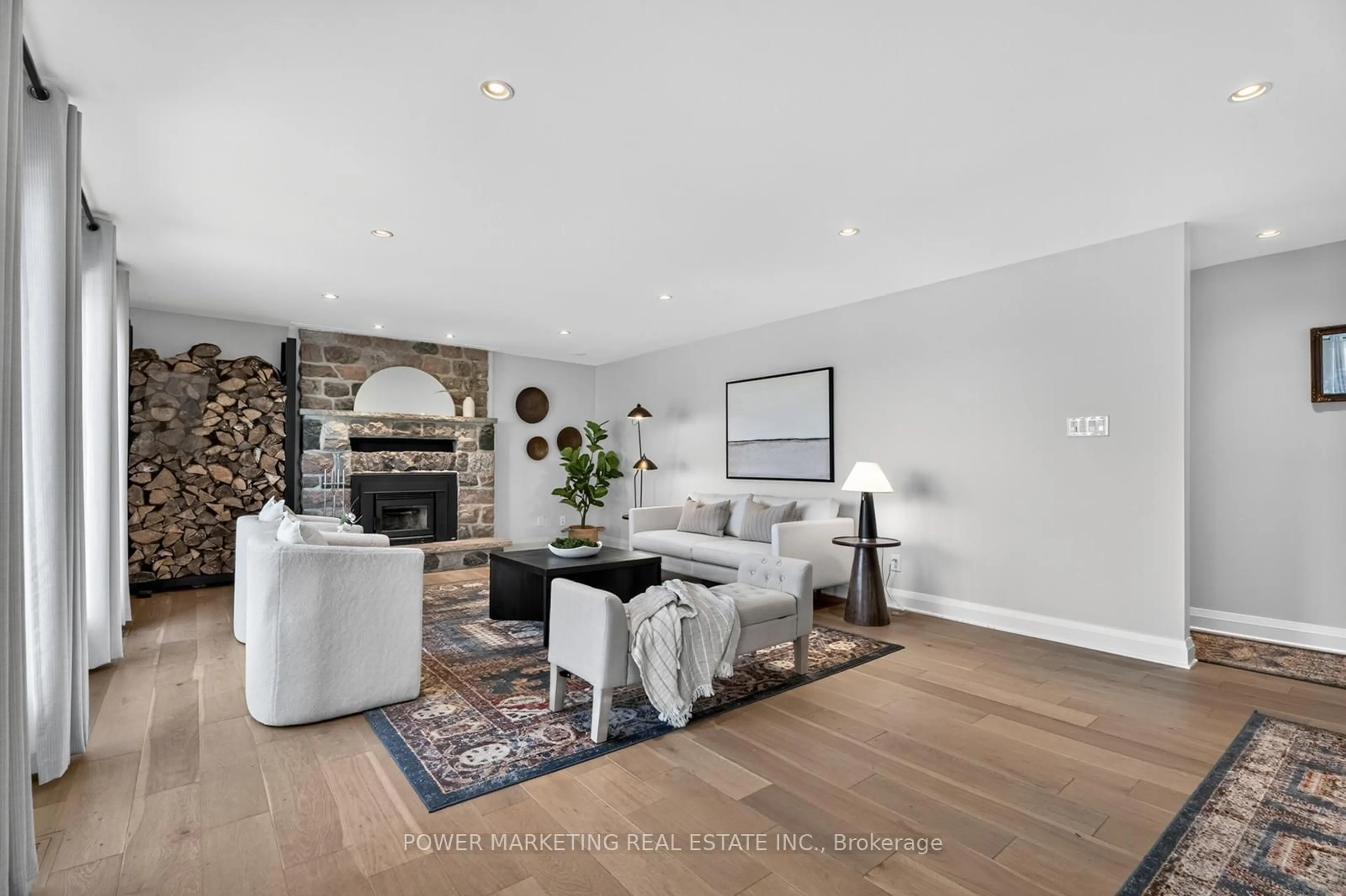 Living room with furniture, wood/laminate floor for 3329 Swale Rd, Osgoode Ontario K0A 2W0